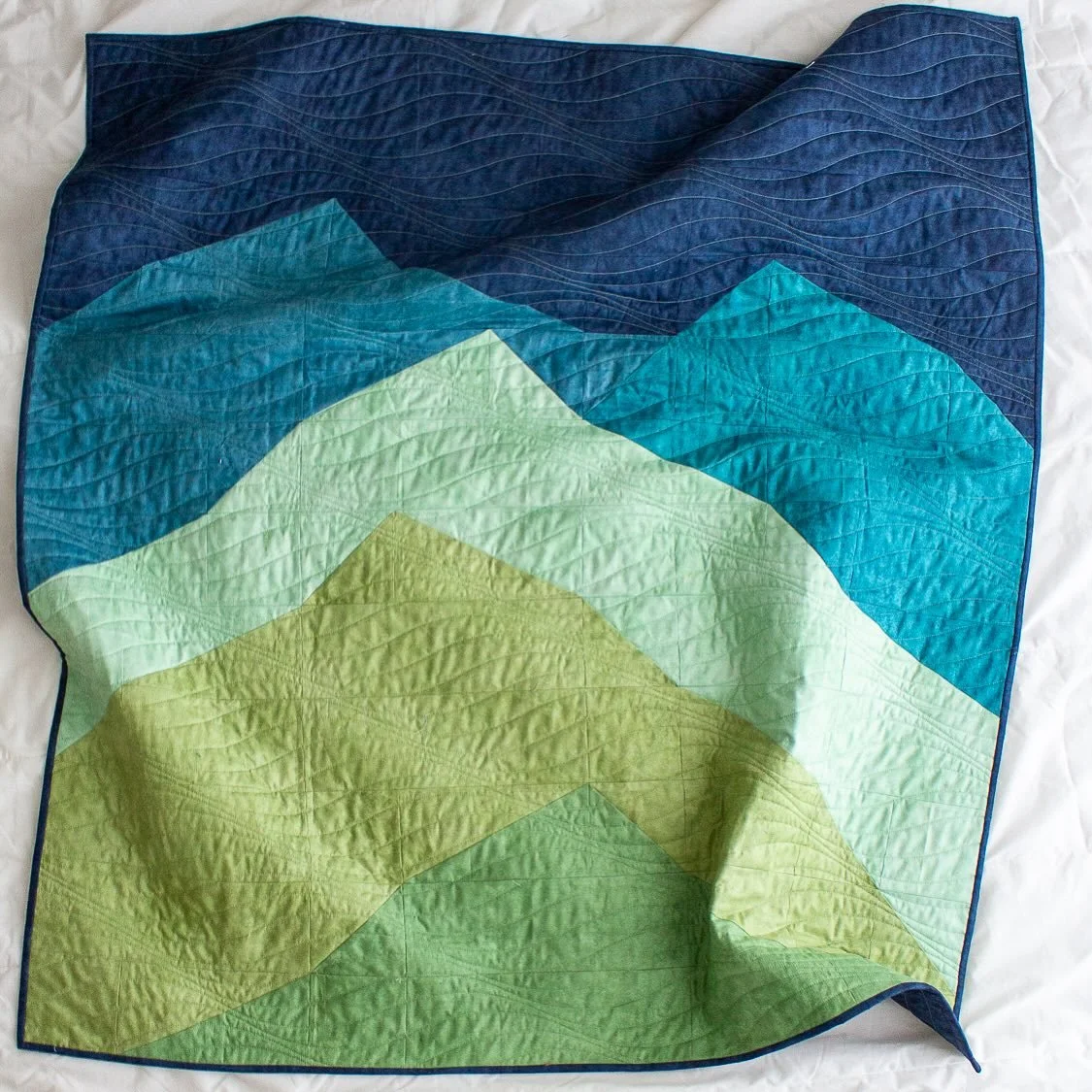 The #MountainsQuilt pattern is back and it&rsquo;s bigger - and also smaller - than ever! This design originally appeared in the Modern Landscape Quilts book featuring two project sizes. The upcoming pattern, which drops on December 5, will include f