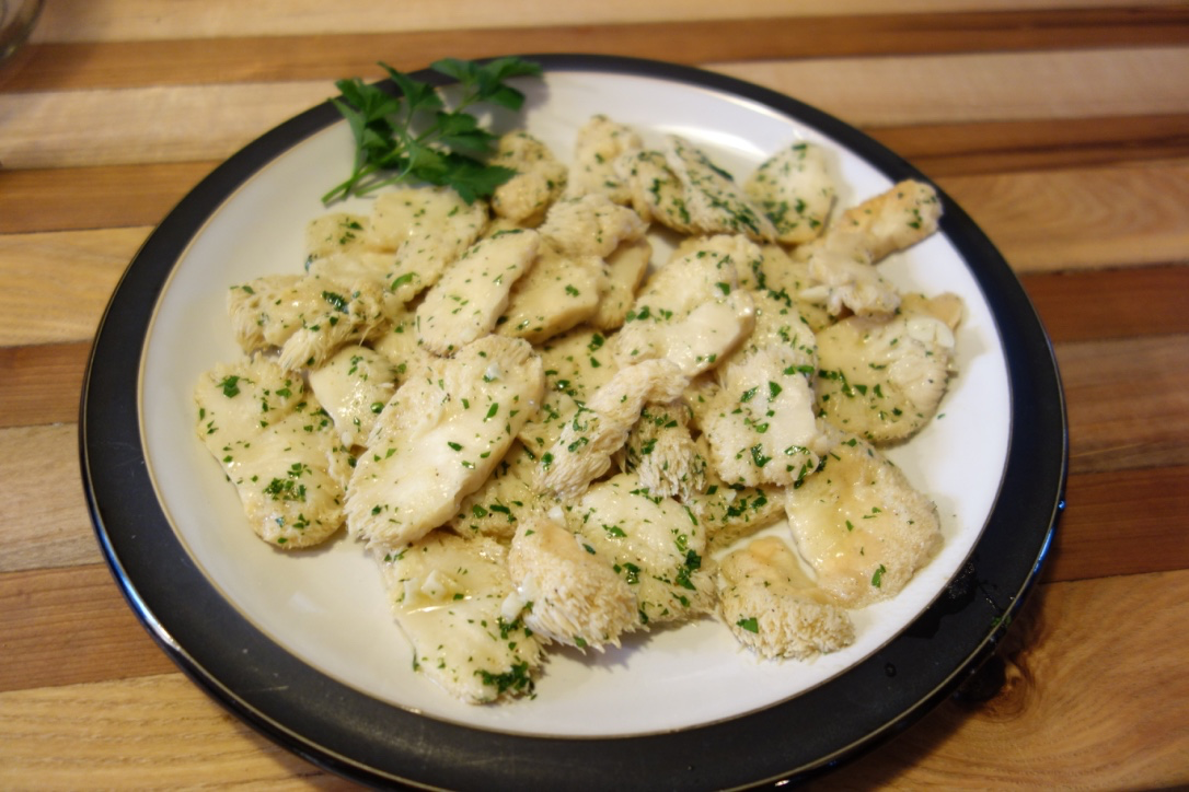 Ingredients: ½ lb Lions Mane Mushrooms, cut into 1/4" slices (serves 2) 1/2 cup clarified butter 1/4 cup dry white wine 1/4 cup chicken stock 1 large clove garlic, coarsely chopped 1/8th tsp kosher salt 1/8th tsp black pepper 1 tsp fresh parsley, finely minced Preparation: Place all of the poaching ingredients except the mushroom and parsley in a small pot and bring temperature to 160 f over med-low to low heat. Add the mushroom and allow to poach for 30 minutes. Add the parsley and poach another five minutes. Serve alone, over grilled steaks or as a side dish. Notes* The mushrooms should poach for at least 30 minutes to get tender but will hold just fine over low temps longer than that. You can add more garlic and serve over pasta for a Mushroom Scampi