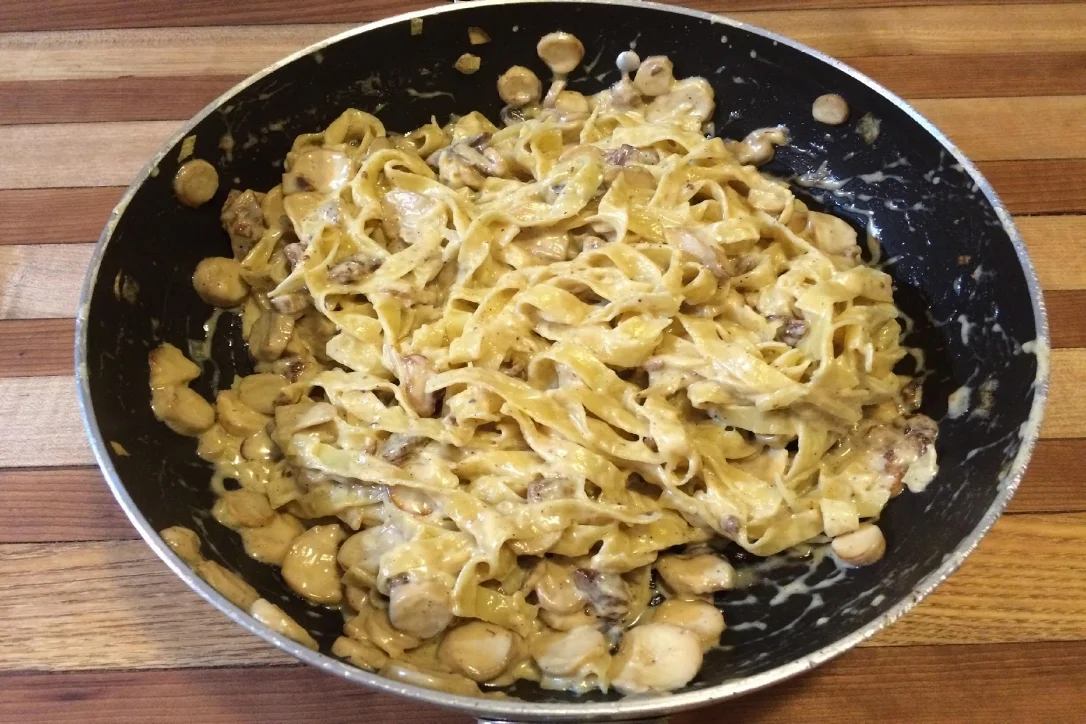 Ingredients: 16 oz fettucciine pasta, cooked and drained 16 oz King Oyster Mushrooms, or any other variety, sliced or chopped 3 Tbsp olive oil 1 cup heavy cream 1/2 cup butter 1 - 2 cups parmesean cheese, grated (can also mix in romano cheese) Salt and Pepper to taste Optional Items: ½ lbs bacon, cooked and crumbled 2-3 shallots, diced 2-3 cloves garlic, minced ½ cup cream sherry ½ tsp allspice Preparation: Slice mushrooms, sauté mushrooms in 2-3 Tbsp olive oil on medium to medium-high heat until browned about 5-7 minutes. If using shallots or garlic, add to the mushrooms about half way through the sauté. If using cream sherry, bacon or allspice, add at the end of the sauté and cook with the mushrooms 2-3 minutes to absorb some of the liquid. On medium-high heat, add butter to pan and melt over medium heat, stirring regularly Add Cream and continue to cook until sauce is bubbly and thickens.. Reduce heat to medium heat and add cheese in 2-3 additions, stirring and melting in between each addition. Add enough cheese to achieve smooth consistency and to taste. Add cooked pasta and toss to coat. Add salt and pepper to taste