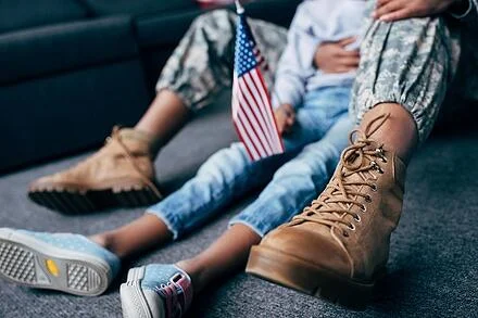 Veteran and child with flag (1).jpg
