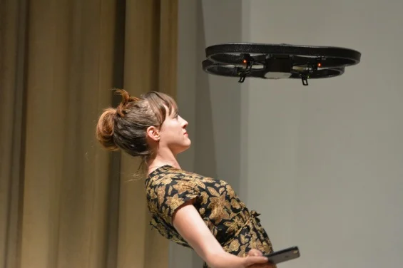 “AUNTSforcamera” Production Week: Open Studios (September 10–14, 2014). Photo: Travis Chamberlain. Pictured: Cara Francis dances with a drone in production for her work REMOTE