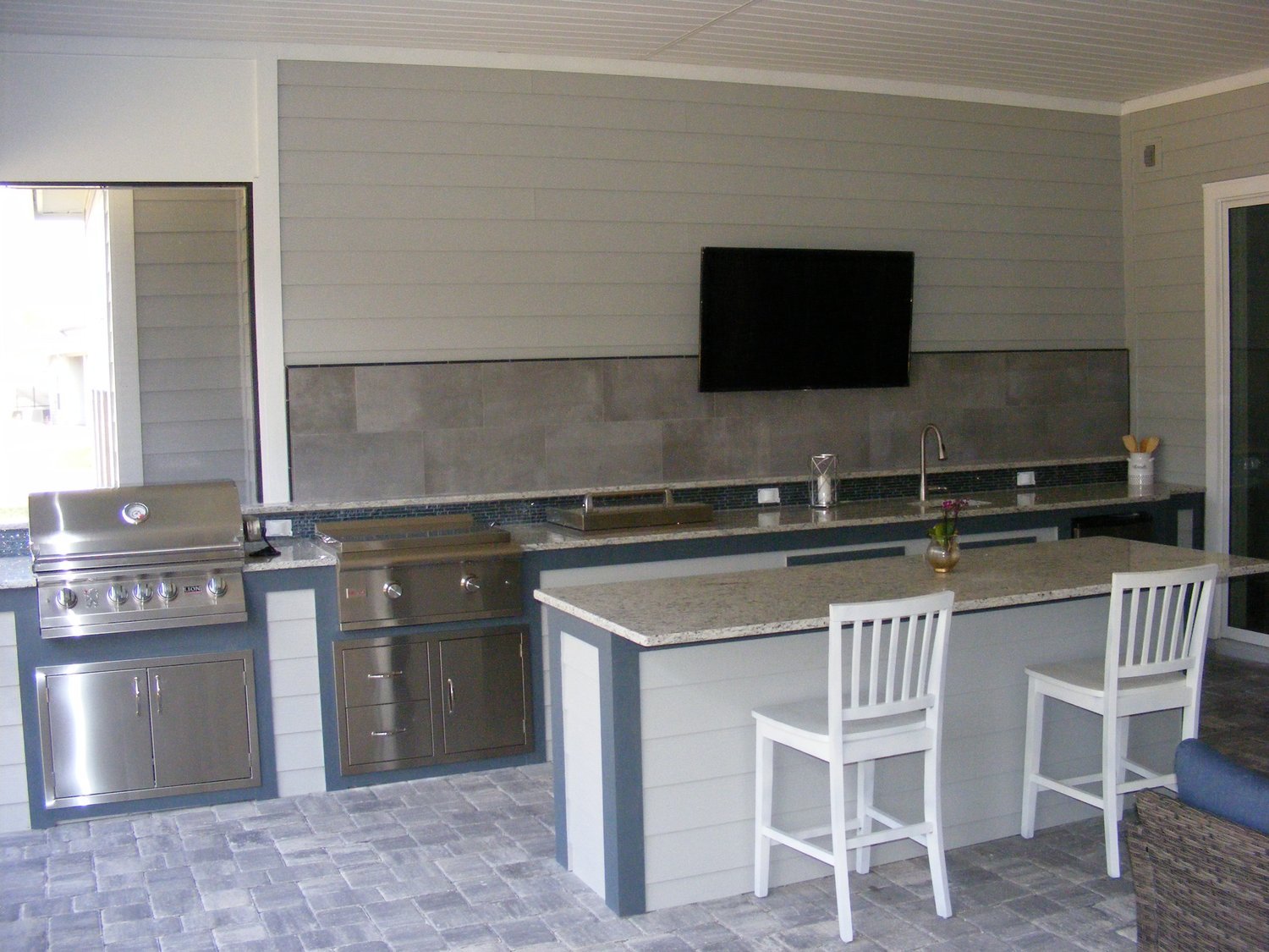 Long Kitchen with Tile Backsplash and Island Bar.jpg