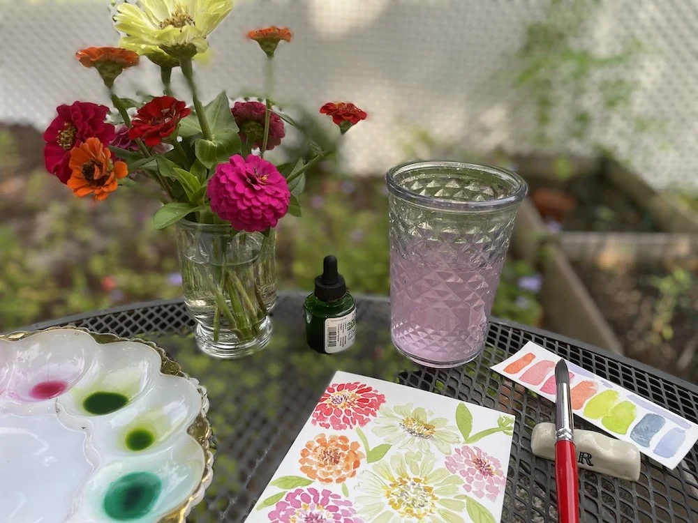 zinnias on table in garden.jpeg