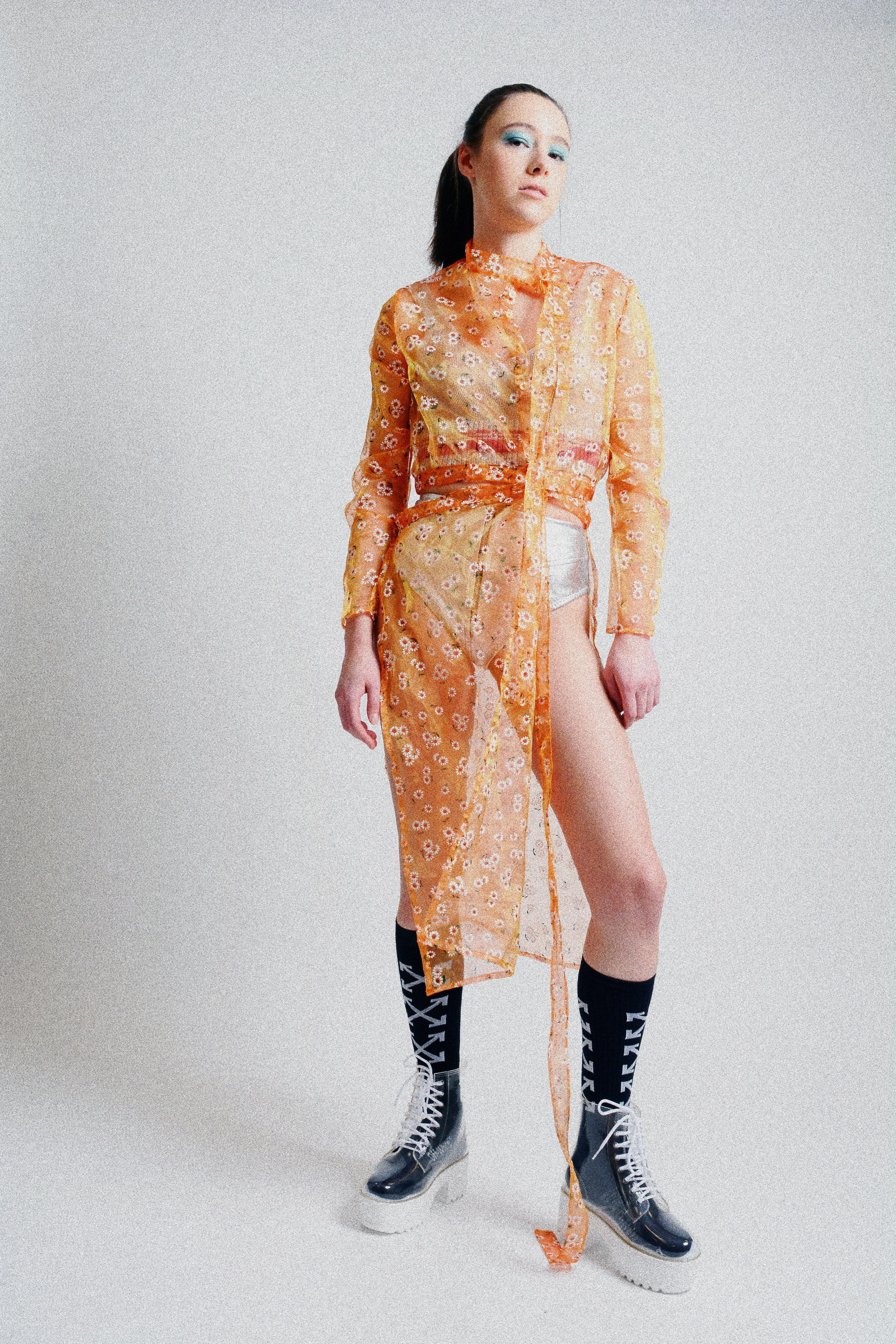 Flower coat: Hannah Erikson Top: Top Shop Bottom: Evan Clayton Boots: Jeffrey Campbell Socks: Off White