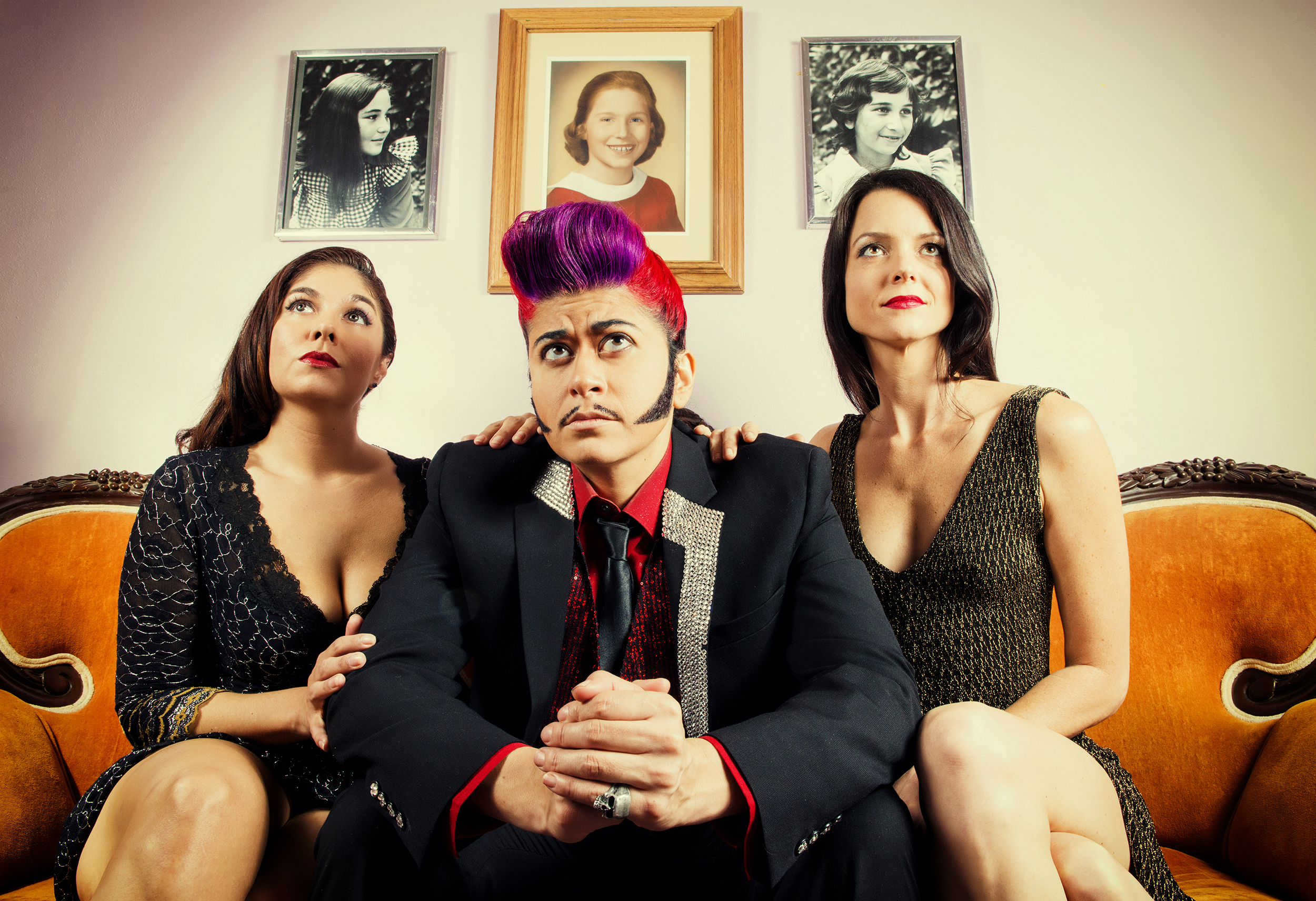  Trigger Mortis, aka Buck Wylde, sits between Carmel Sutra and Taylor Anne Ramsey at Texas Theatre in Dallas, TX.  Mortis worked as a corporate marketing professional by day before moonlighting as Buck Wylde, a suave, hyper-masculine drag king emcee.