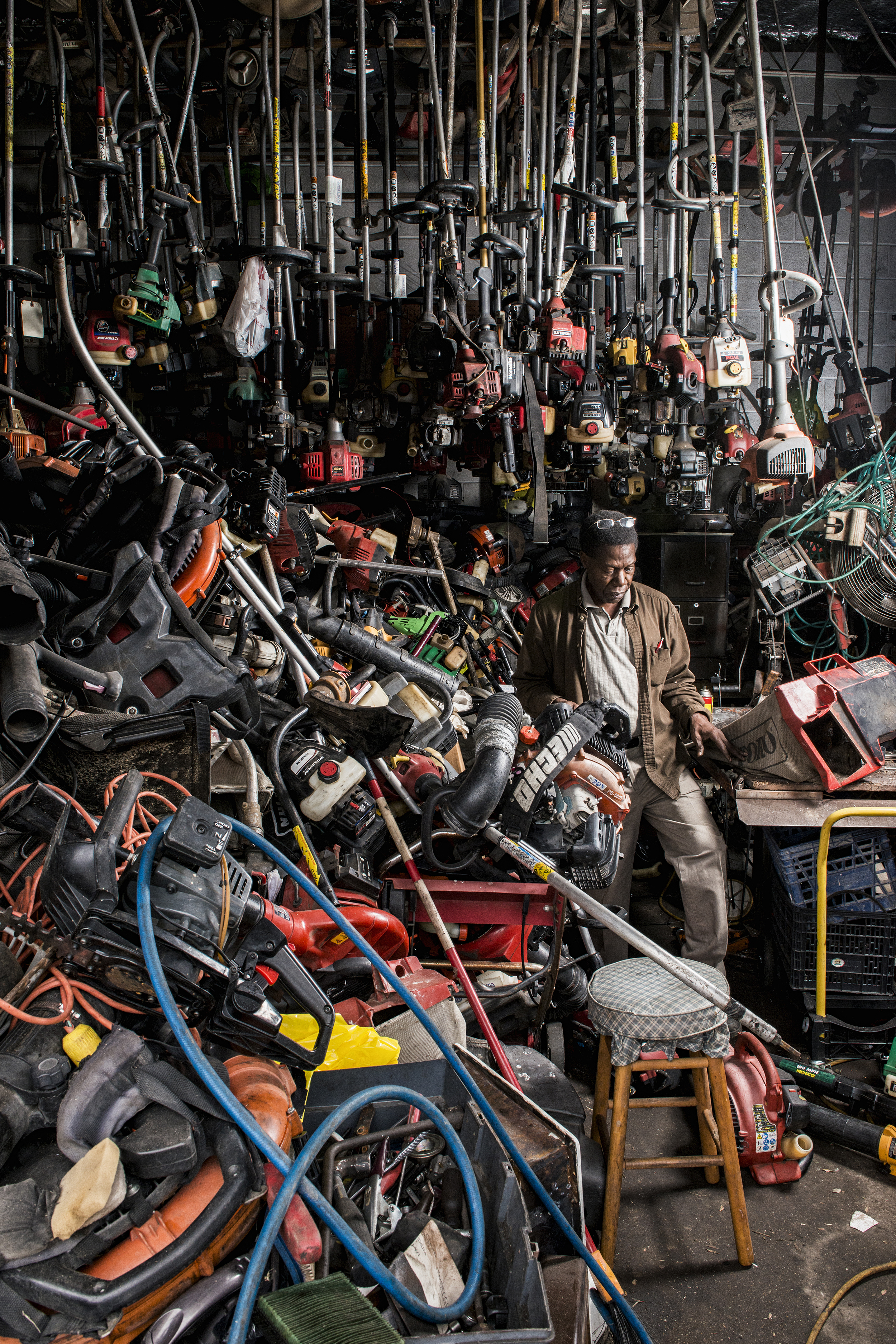  Elijah Day, owner of Oak Cliff Paint and Hardware, wades through his inventory in the Oak Cliff neighborhood in Dallas, TX.  After serving in the U.S. Navy during the Vietnam War, Day followed his then-sweetheart to Dallas.  In 1974, he took a job a