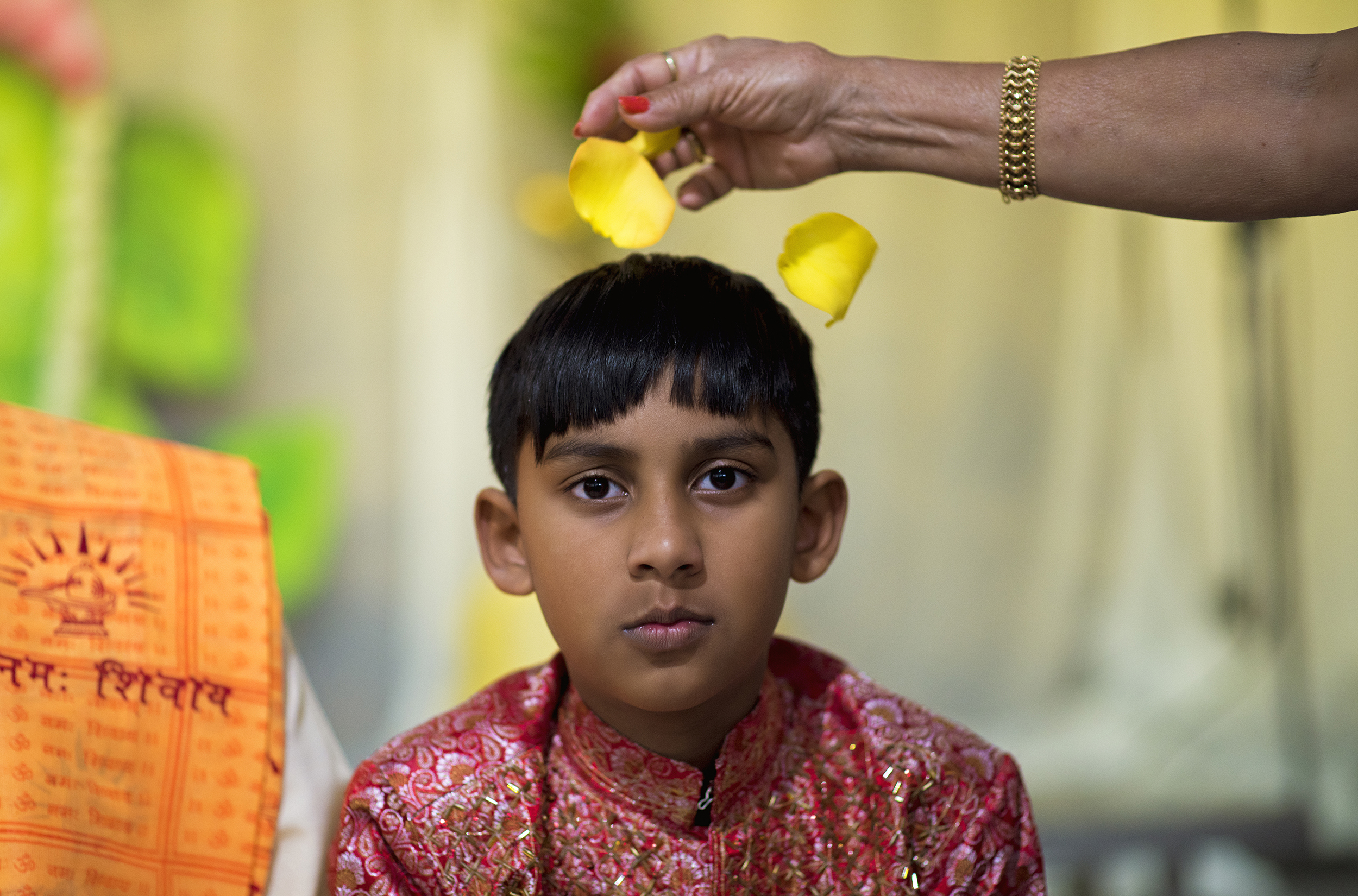  Alexander Sukhu is showered with flower petals on his birthday at the North Texas Hindu Mandir in Dallas, TX.  Since the North Texas Hindu Mandir was the only place of worship of its kind in the region, some congregants regularly drove three hours t