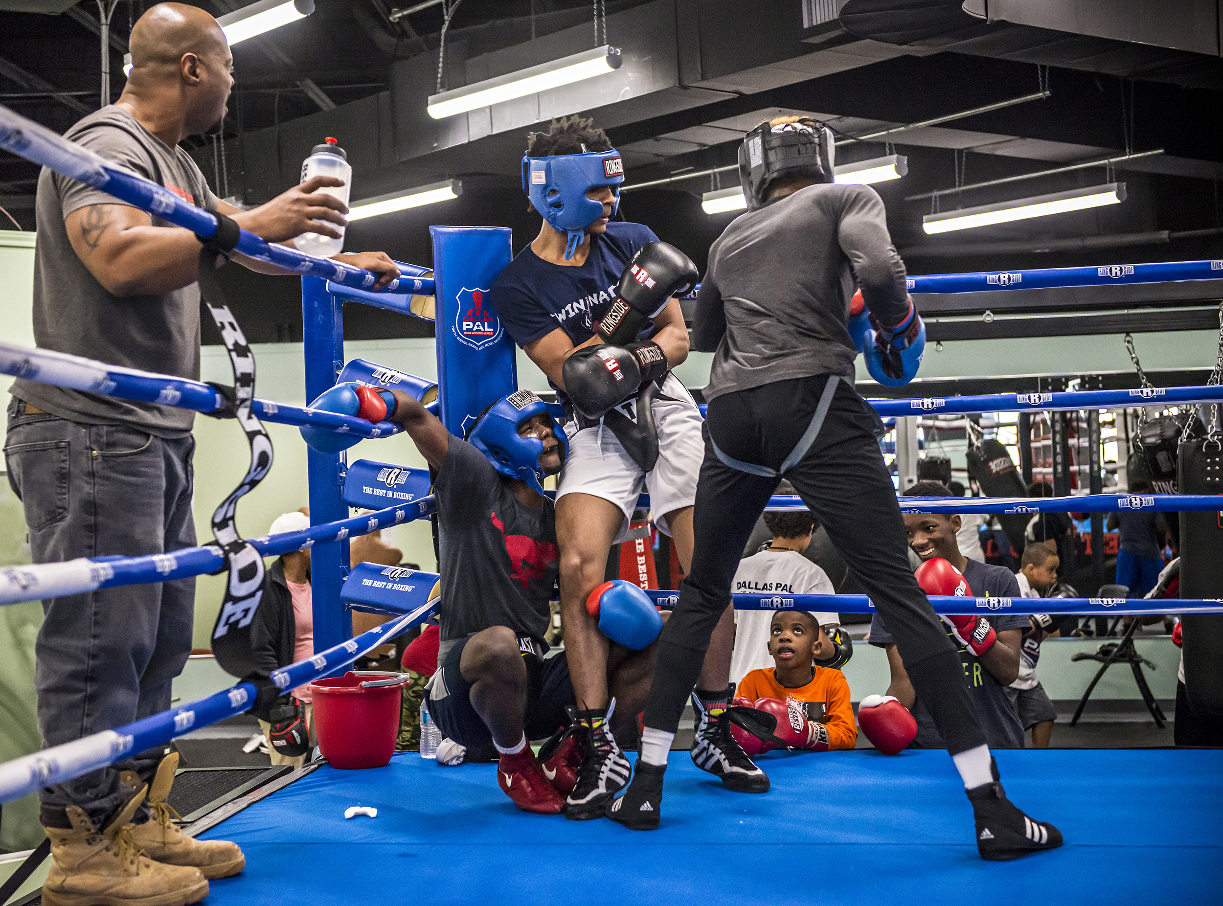  Teens spar at the North Lake Highlands Youth Boxing Gym in Dallas, TX.  The boxing gym opened in the crime-beleaguered Forest-Audelia neighborhood in 2017, with Dallas police officers training local children Monday through Friday.  Famed female boxe