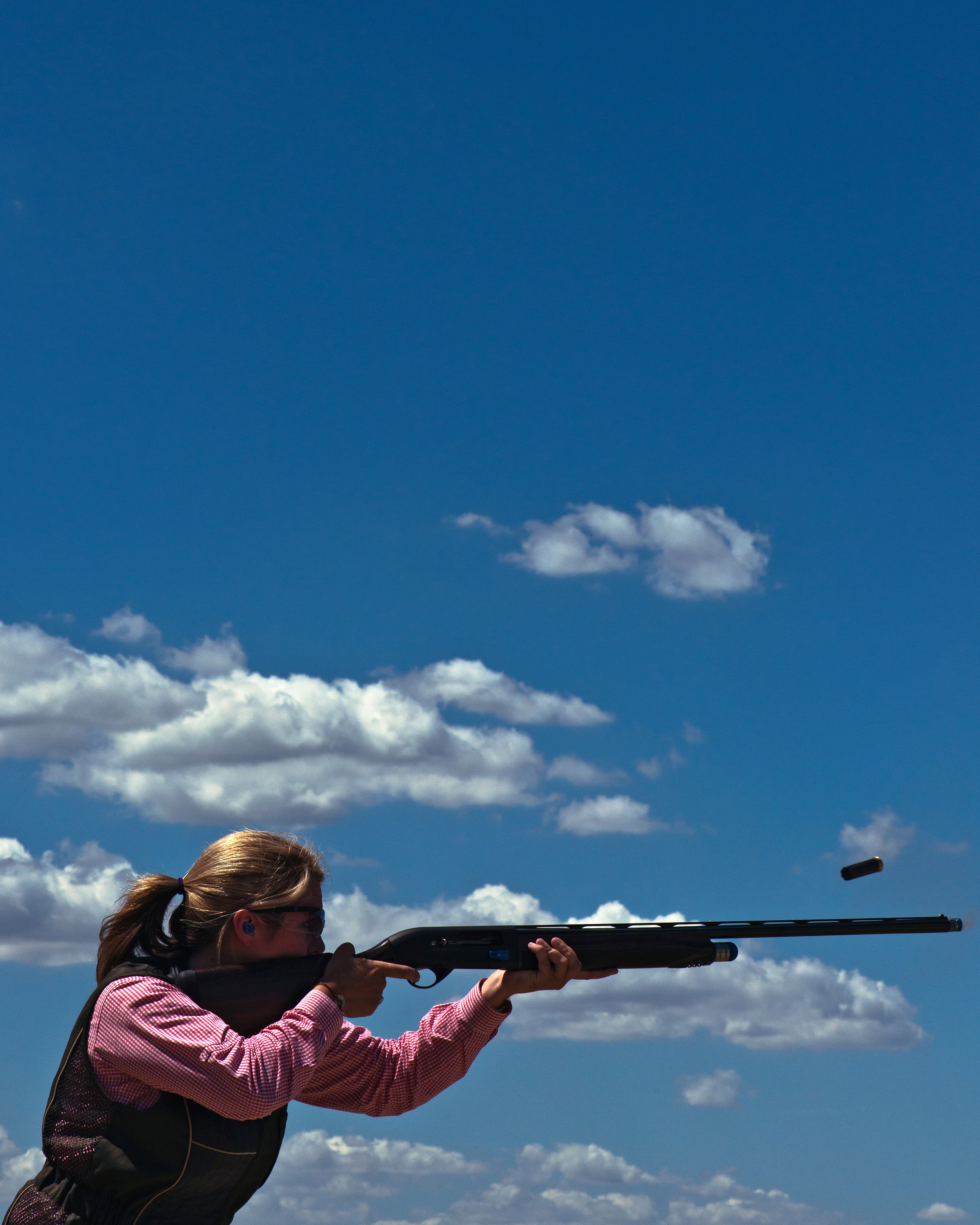  A student fires at a clay target at the Dallas Gun Club in Lewisville, TX under the tutelage of competitive shooter Jeanie Almond.  Almond and her daughter founded Lipstick &amp; Lead, an organization that introduced women to firearms for sport and 