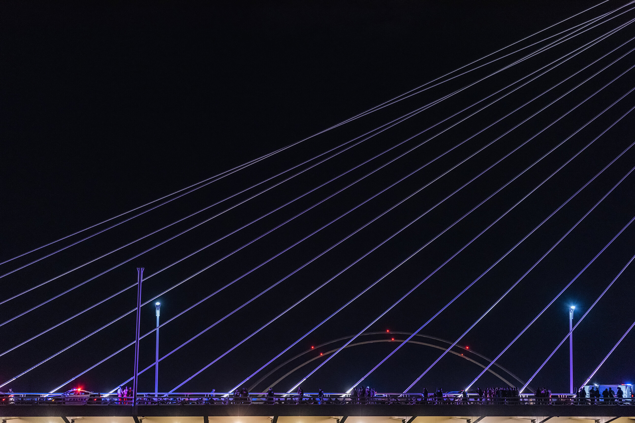  Police detain almost 700 protesters on the Margaret Hunt Hill Bridge in Dallas, TX on June 1, 2020.   After the City imposed a localized 7 p.m. curfew intended to curtail ongoing protests in downtown Dallas, marchers rallied on the edge of the curfe