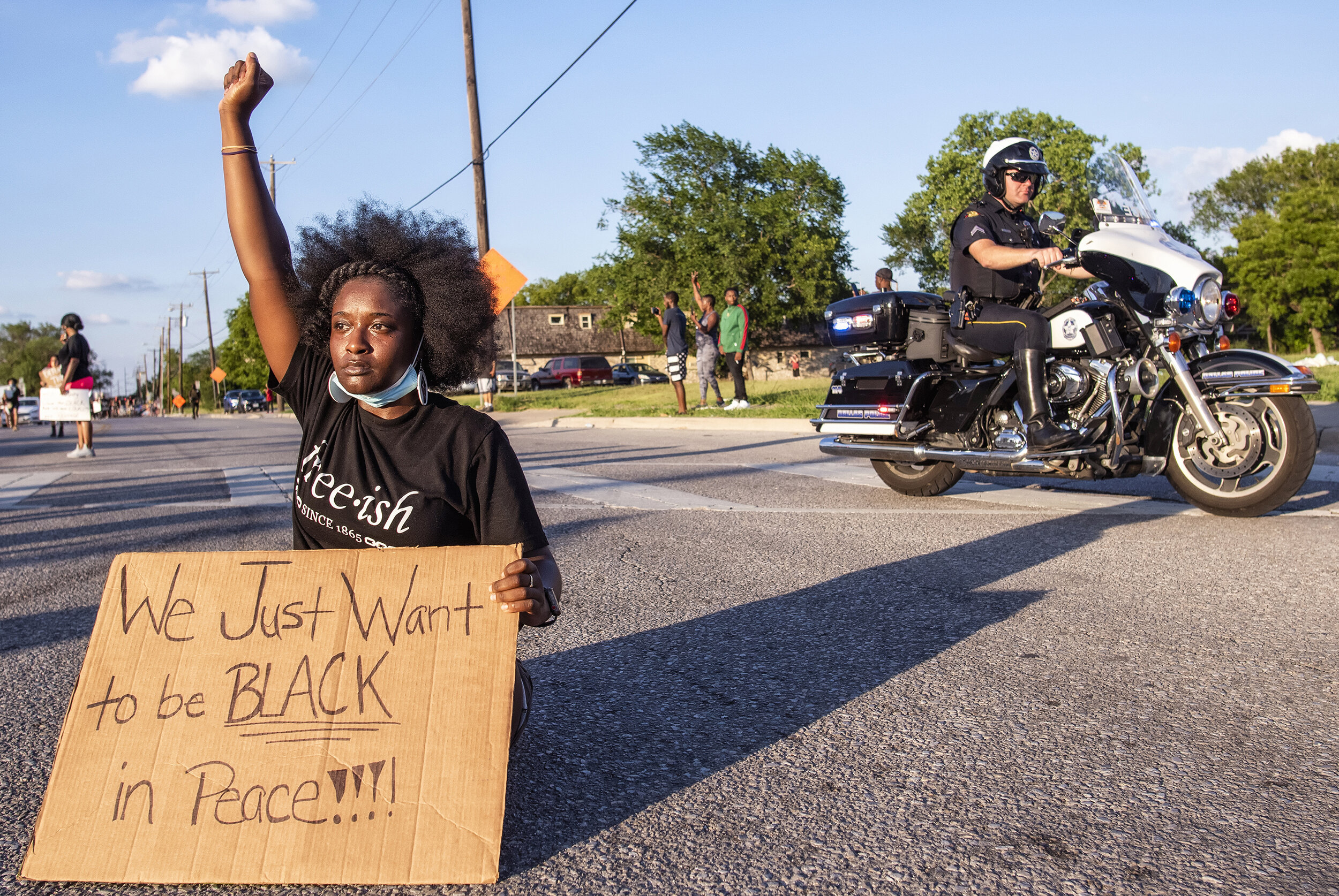  Protesters occupy the intersection of Al Lipscomb Way and South Good Latimer Expressway in south Dallas, TX on June 7, 2020.  After public outcry over aggressive police tactics employed to quell recent protests, law enforcement took a more passive a