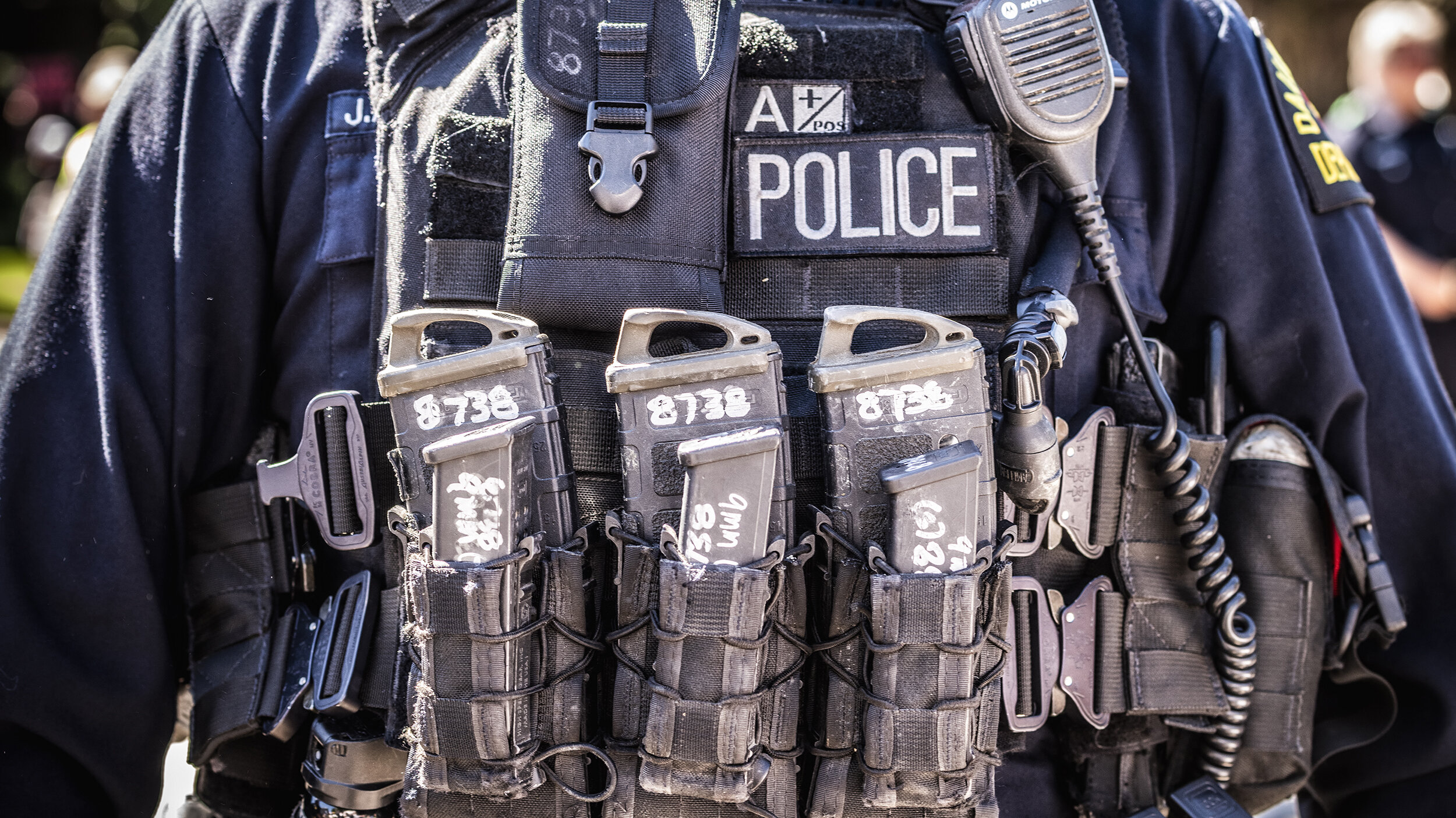  A police officer is laden with magazines at a protest during President Donald Trump’s visit to Gateway Church in the Preston Hollow neighborhood of Dallas, TX on June 11, 2020.  Some officers carried rifles or grenade launchers. 