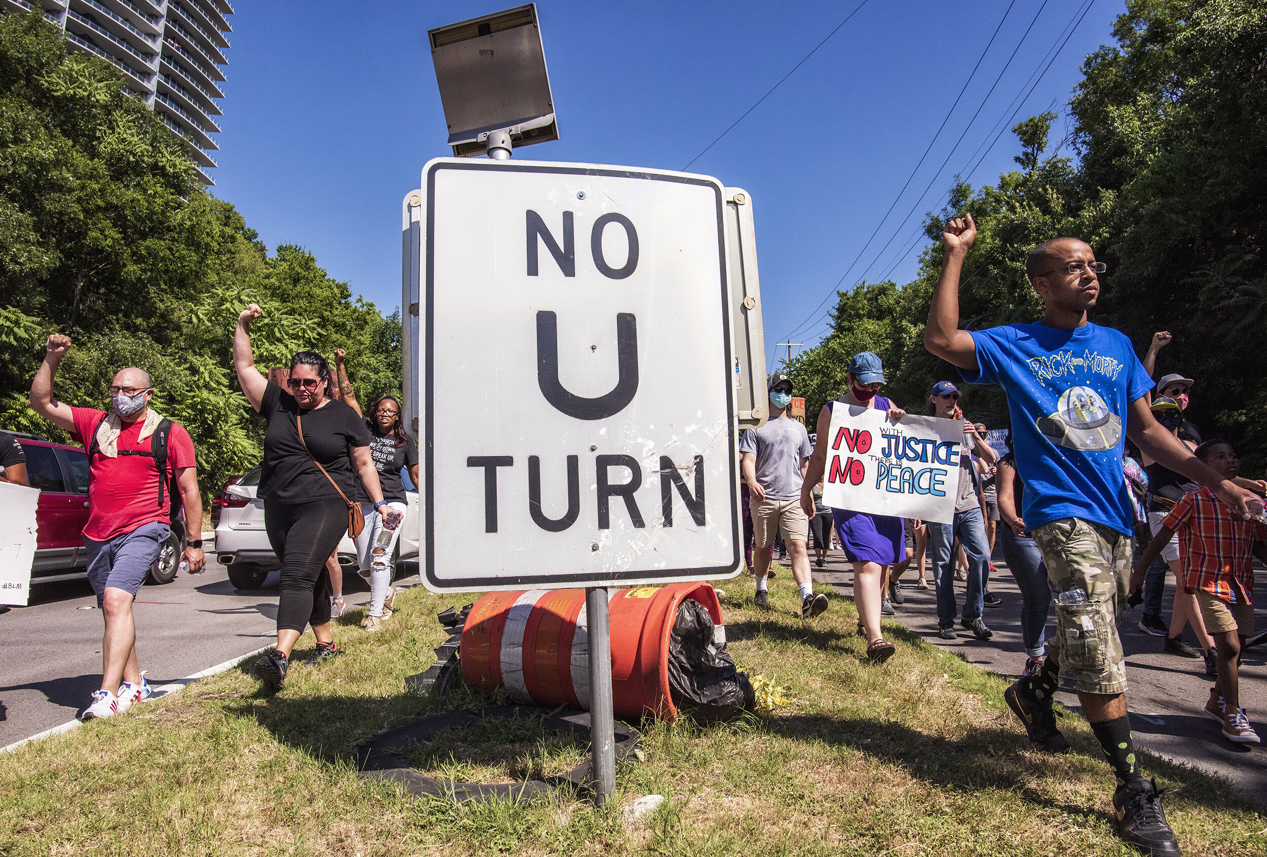  As anti-police brutality protests entered their third week, protesters march down Harry Hines Boulevard near the Design District in Dallas, TX on June 13, 2020. 