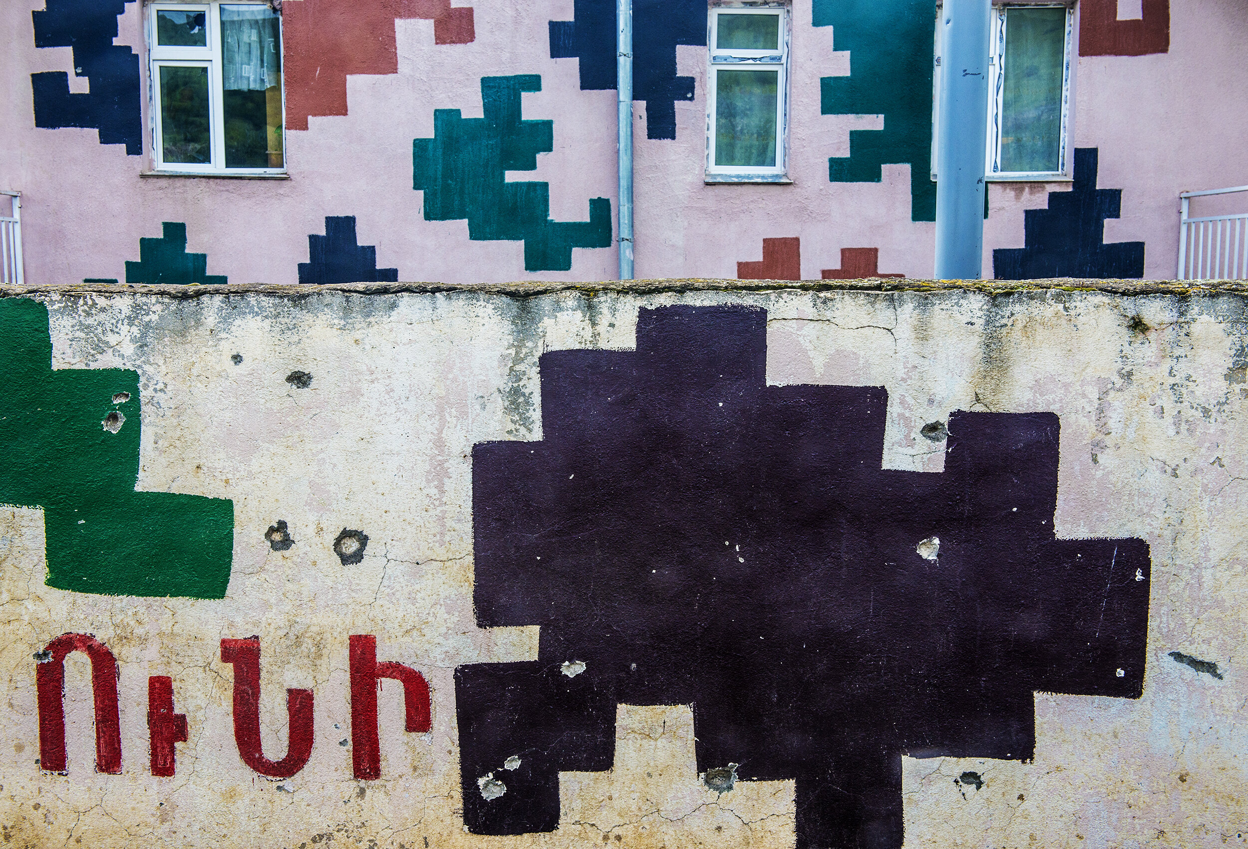  Buildings decorated in digital camouflage bear evidence of fighting in Mataghis, Nagorno-Karabakh.  During the Four-Day War, Azerbaijan tried unsuccessfully to capture the town of 400, located near a valuable hydroelectric plant.  Most of Mataghis’ 