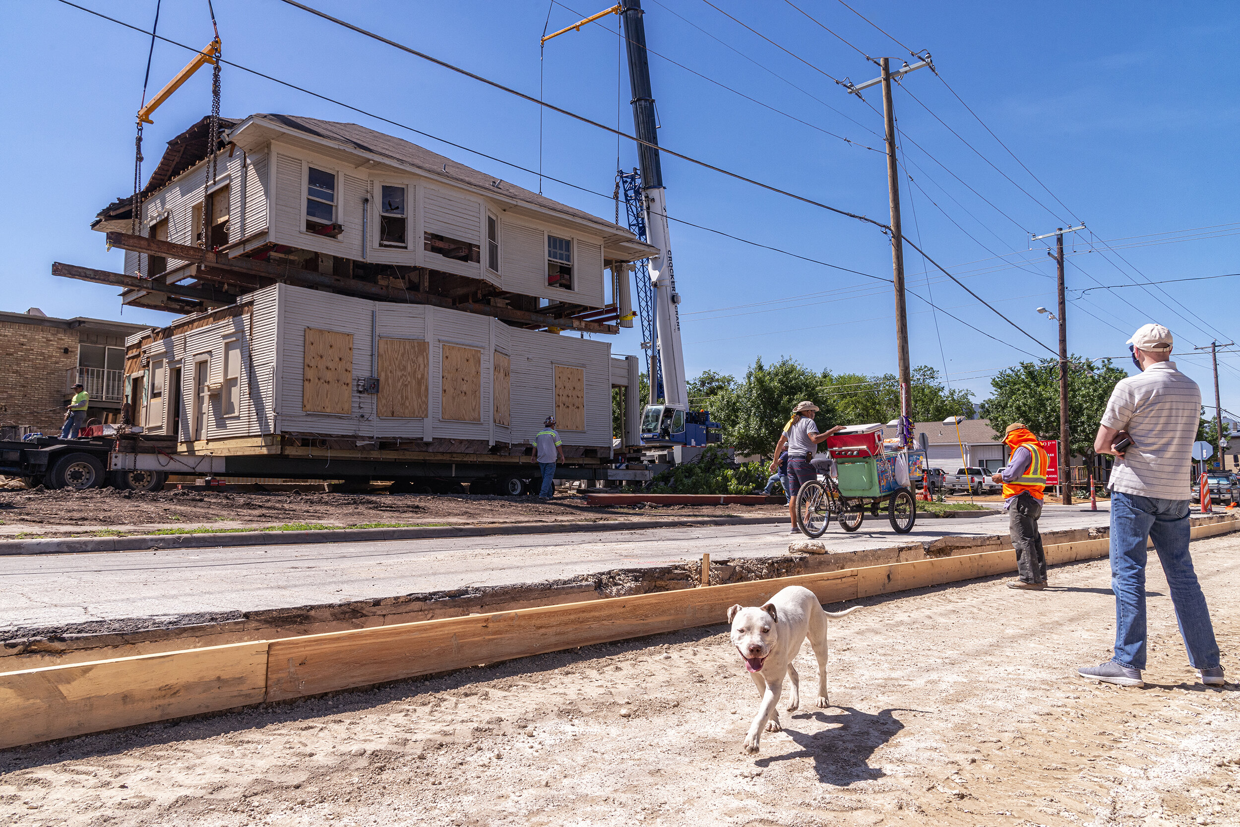  A 115-year-old house is cleaved for relocation in the Oak Cliff neighborhood of Dallas, TX.  When a developer threatened to demolish the 1905 home, architect Alicia Quintans hired McMillan House Movers and Miller &amp; Sons Construction to preserve 