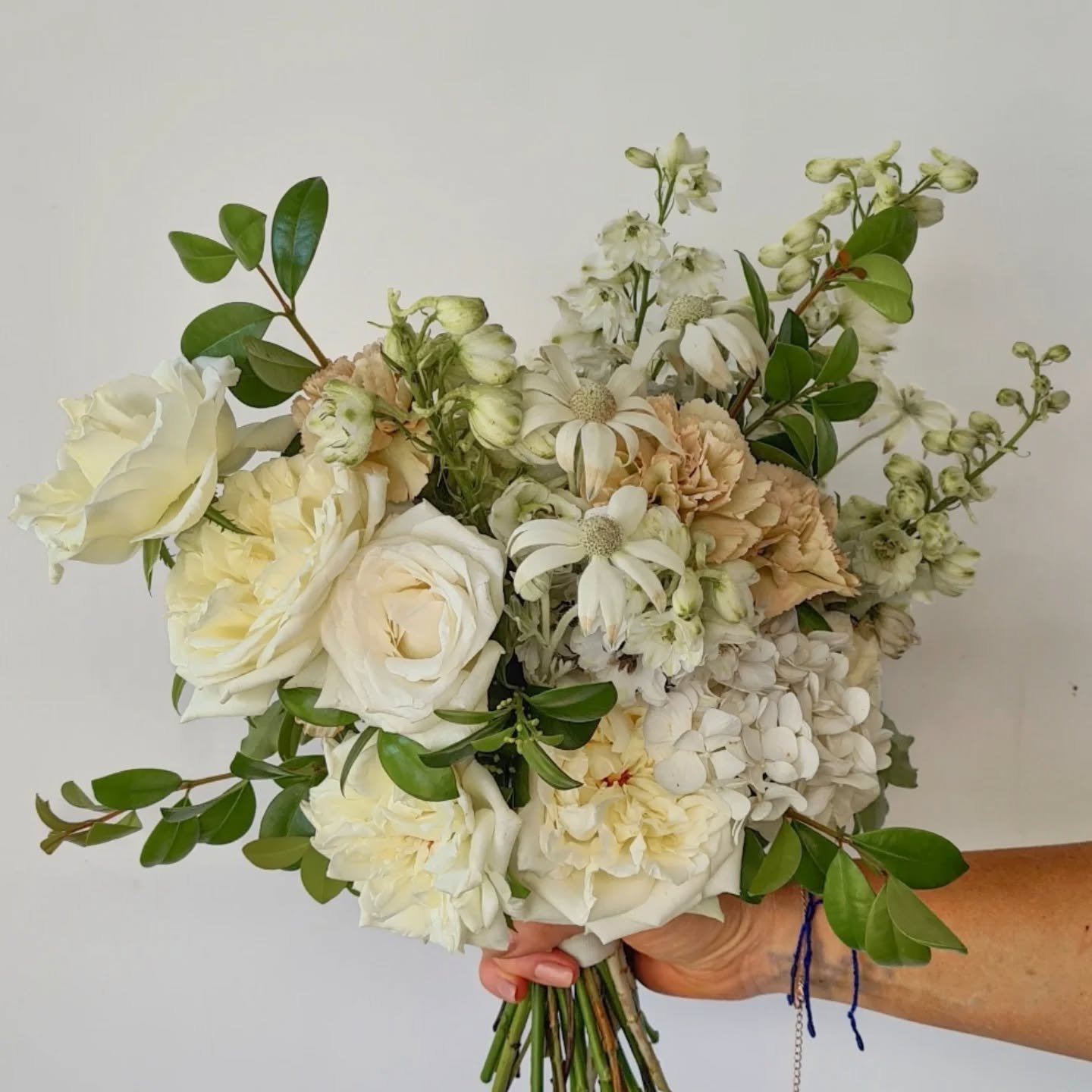 A surprise wedding at your engagement? Oh yes,  she did! For our beautiful bride Yvonne, we created a soft textured bouquet.
For the ceremony, sailing Sydney Harbour Garden style floral pillars framed Yvonne &amp; Neil as they said &quot;I Do&quot; 

