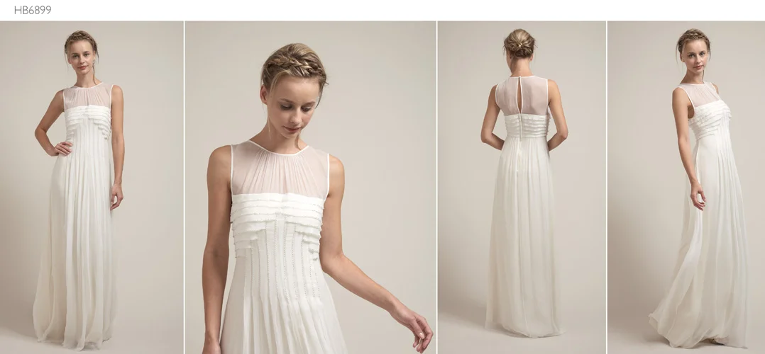 A woman posing in a wedding gown