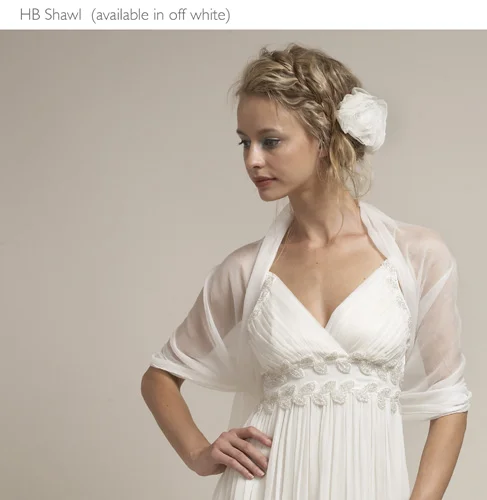 A woman posing in a wedding gown
