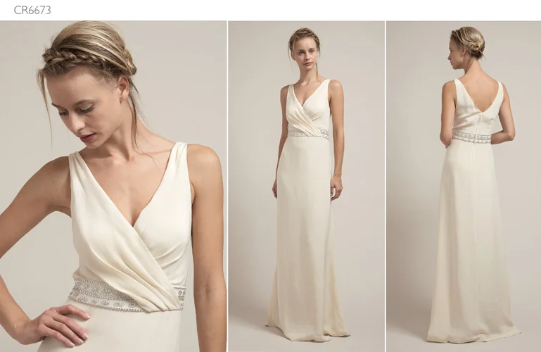 A woman posing in a wedding gown
