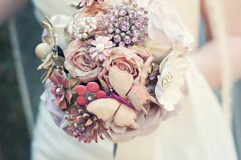 image showing a bride holding a wedding bouquets silk flowers