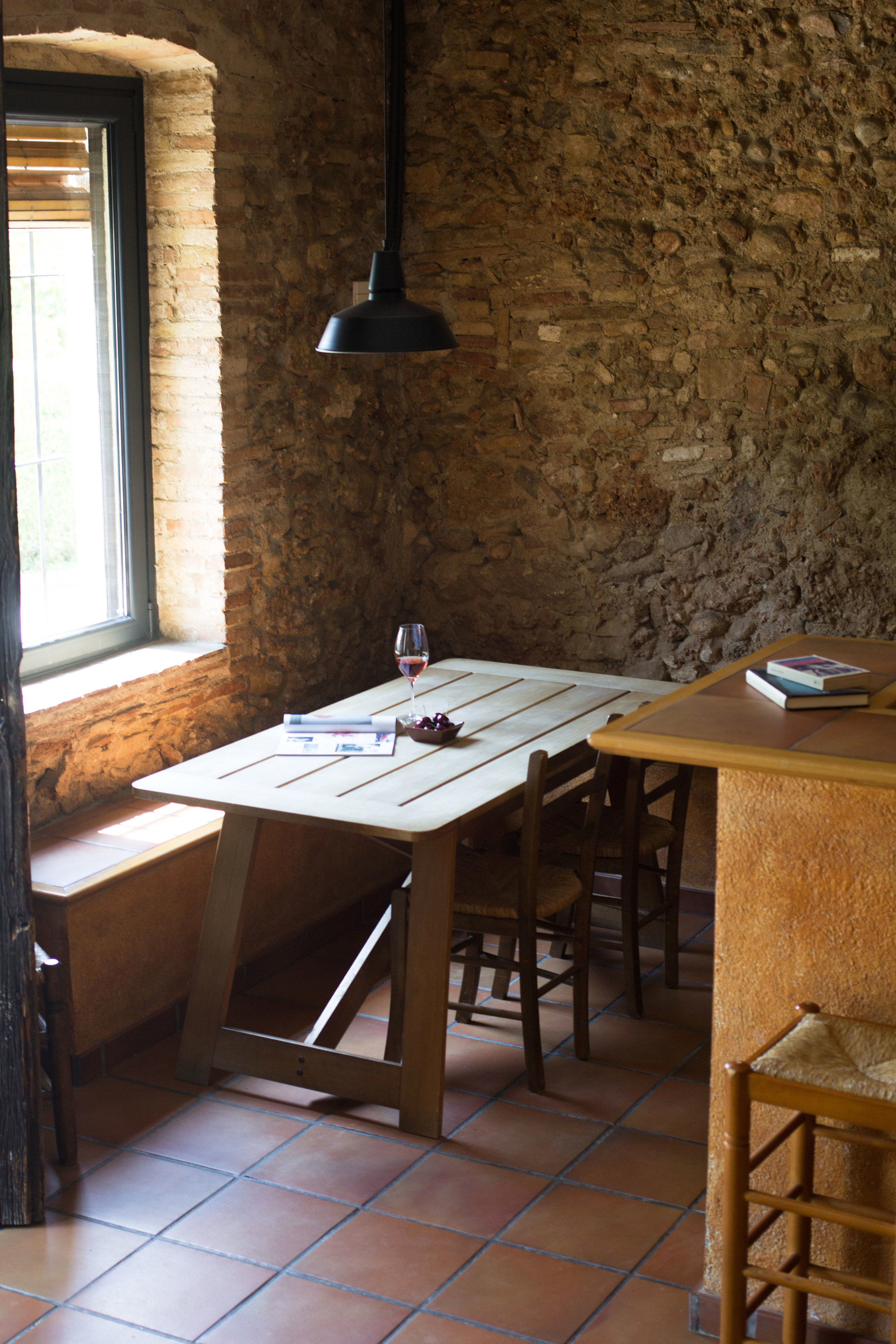 upcycled designed dinner table in the eating area, light pours in from the large window