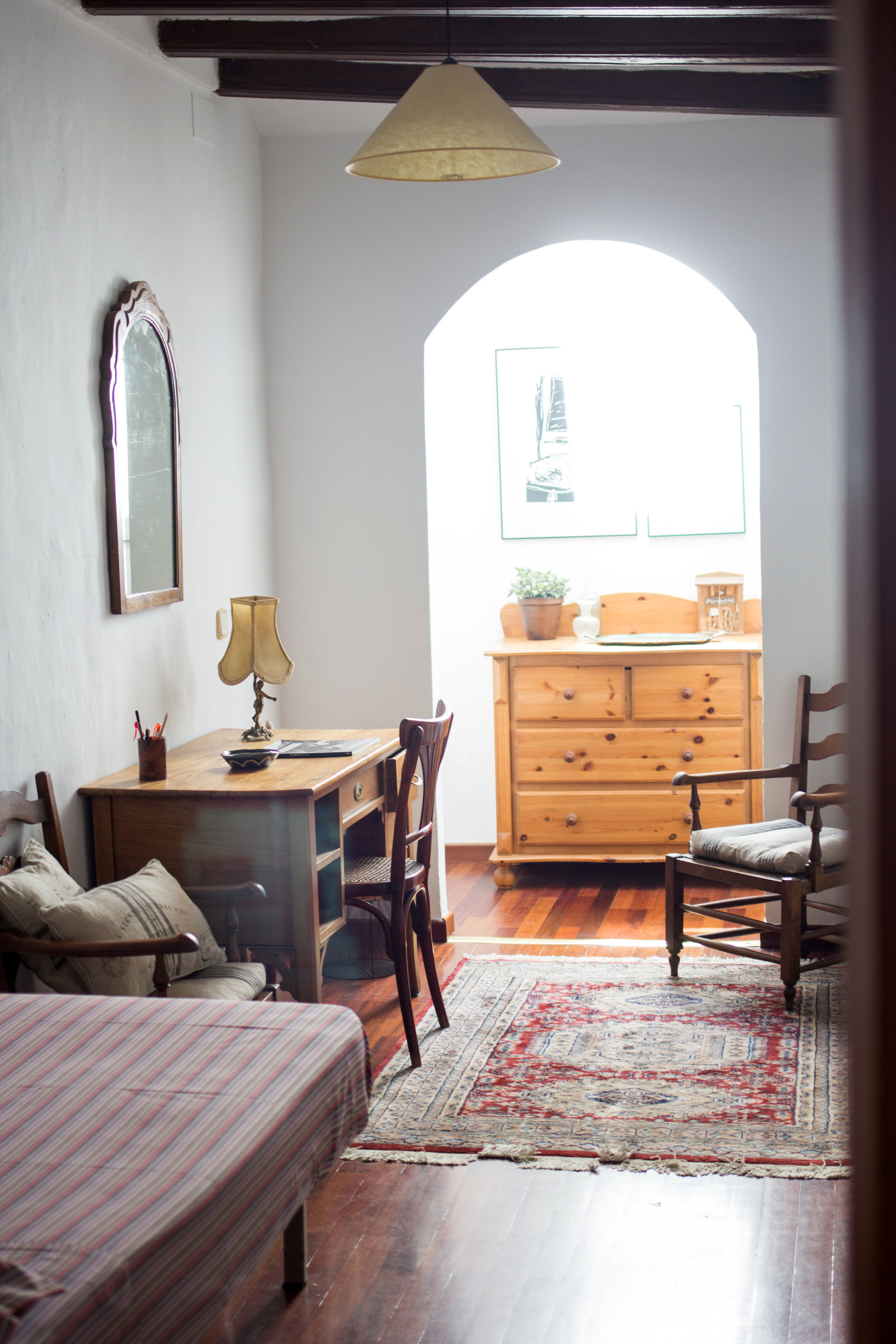 luxurious vintage living room with mediterranean design, a desk and a dresser