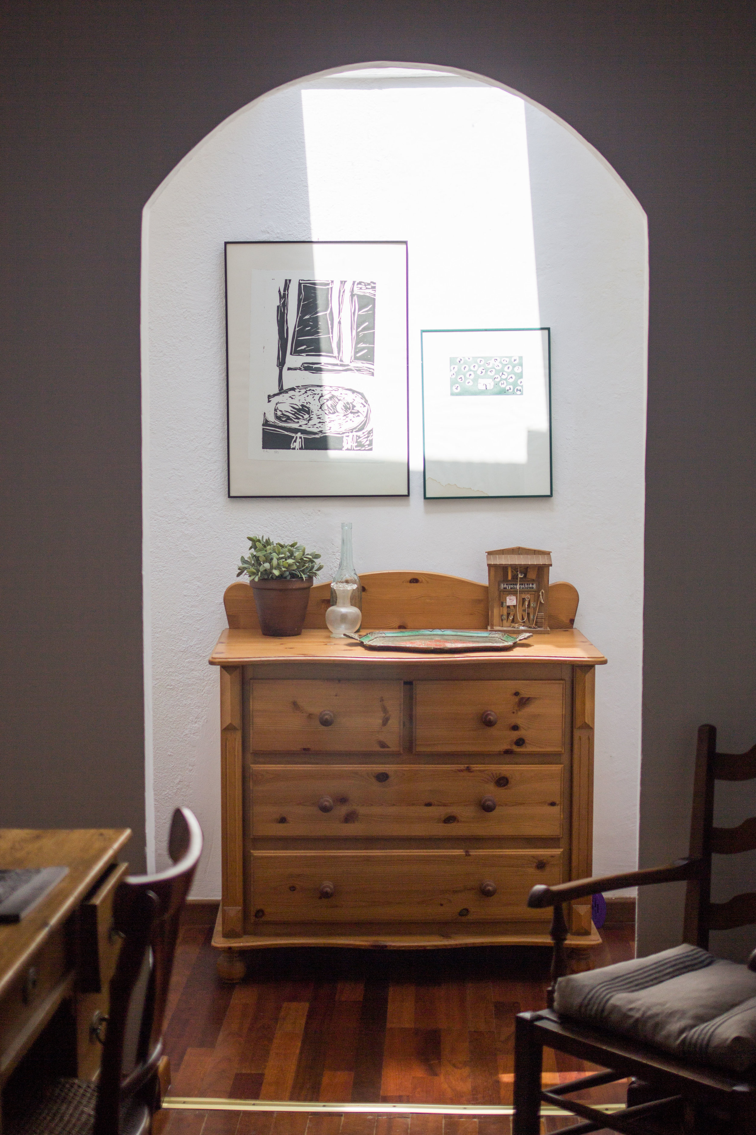 whole wood dresser with artwork 