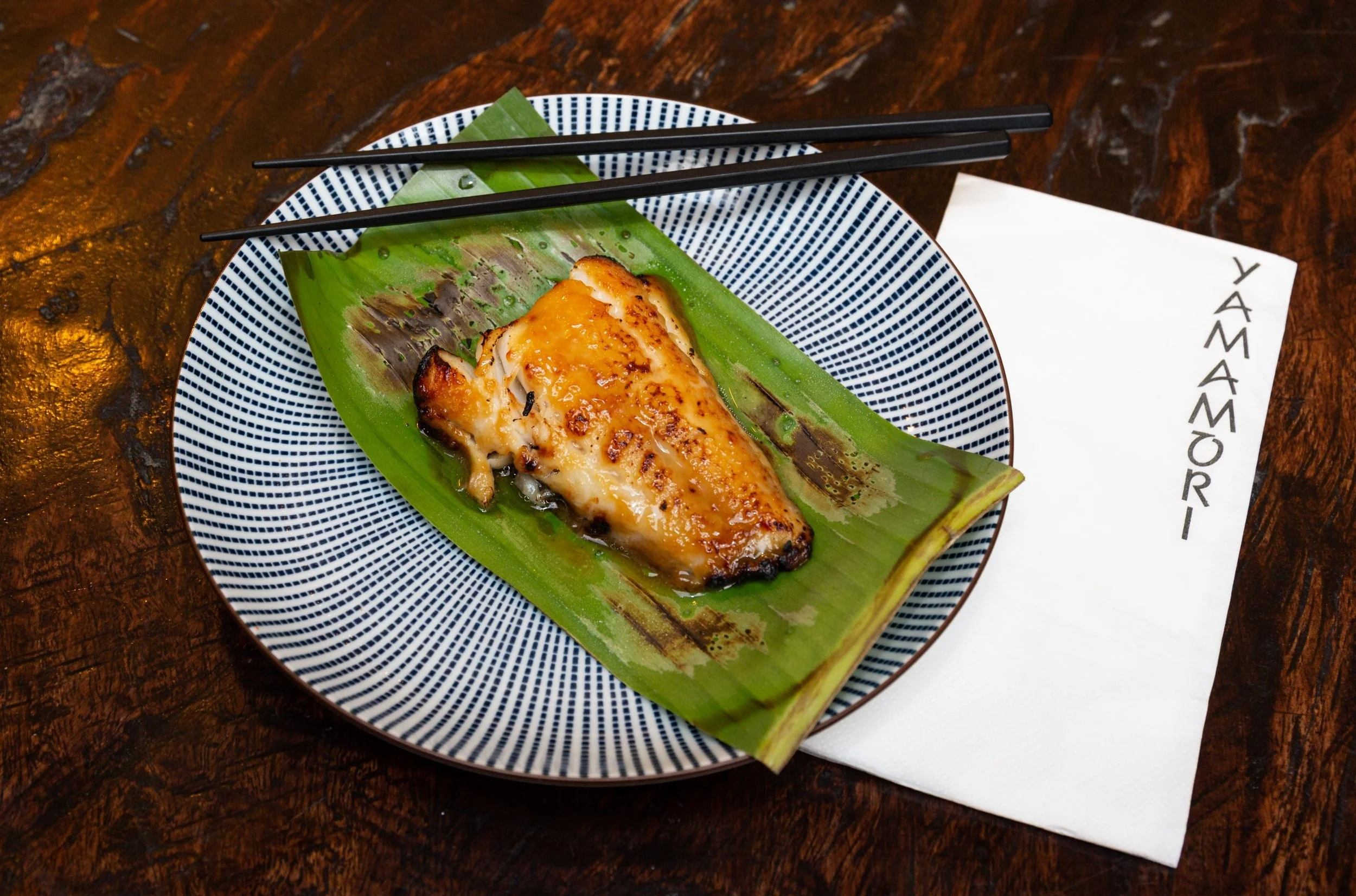 The seared Black Cod served on banana leaf