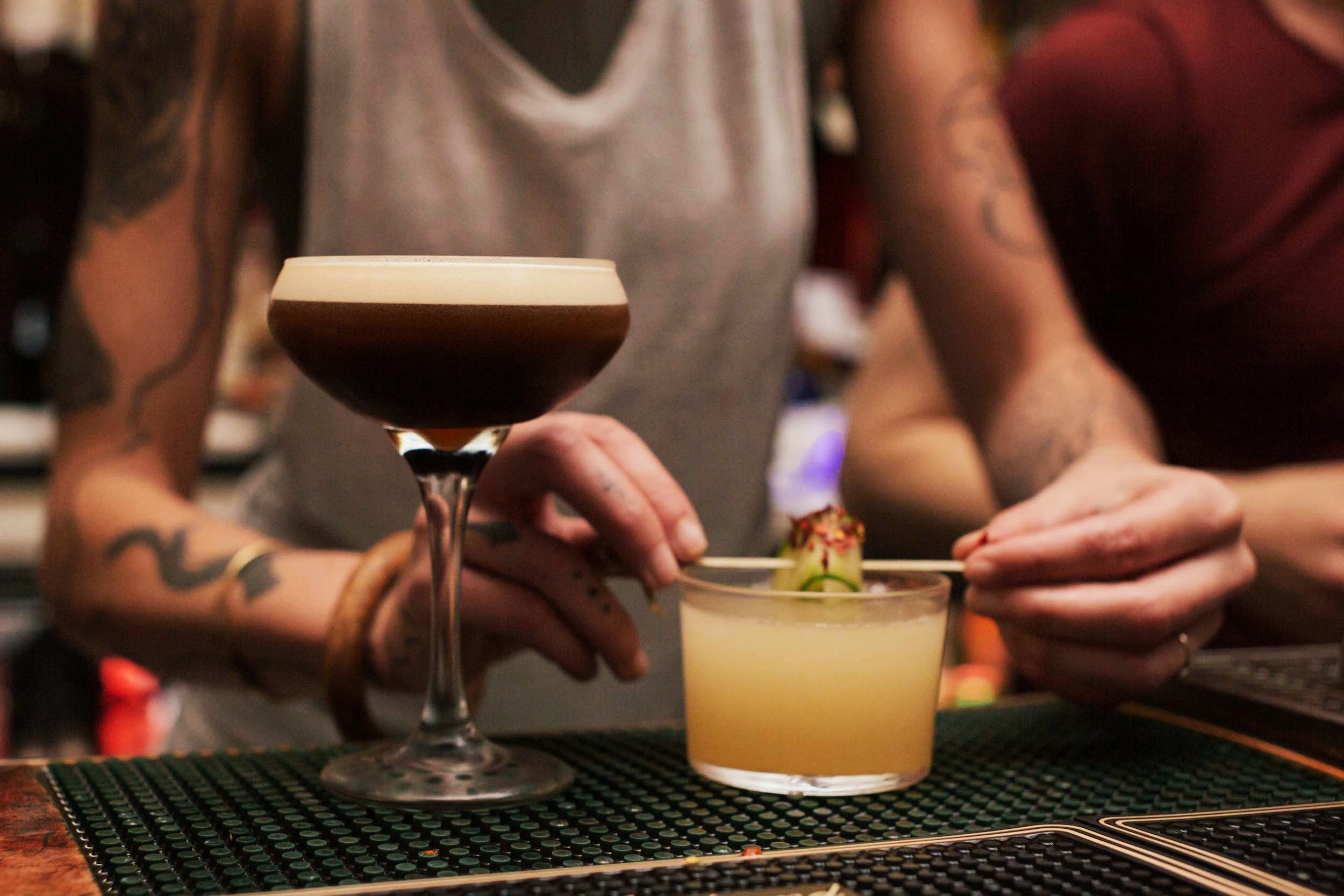 Two of our cocktail bartenders prepare an Espresso Martini (left) and the famous Spicy Asian