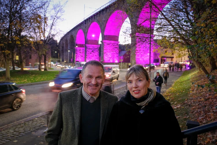 Photo caption: Allan Cook (left) and Sarah Coop (right) in front of the Railway Arches during Lumiere 2017, which will be home to a permanent legacy installation