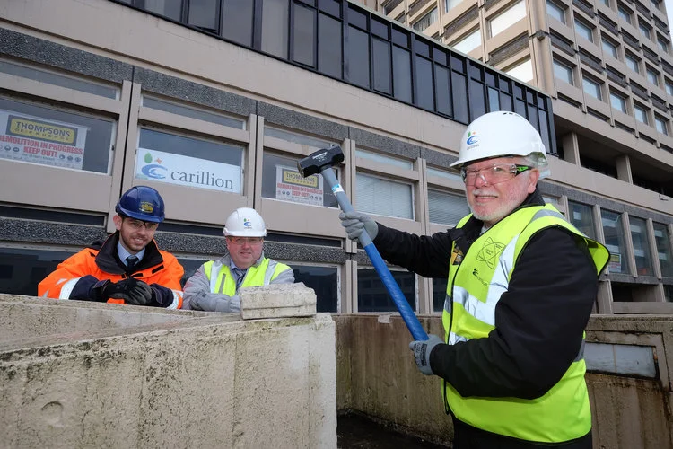 Photo caption: (left to right) Ben Harris (Thompsons) and Steve Hunter (Carillion), look on as David Glencorse starts the demolition of Milburngate House