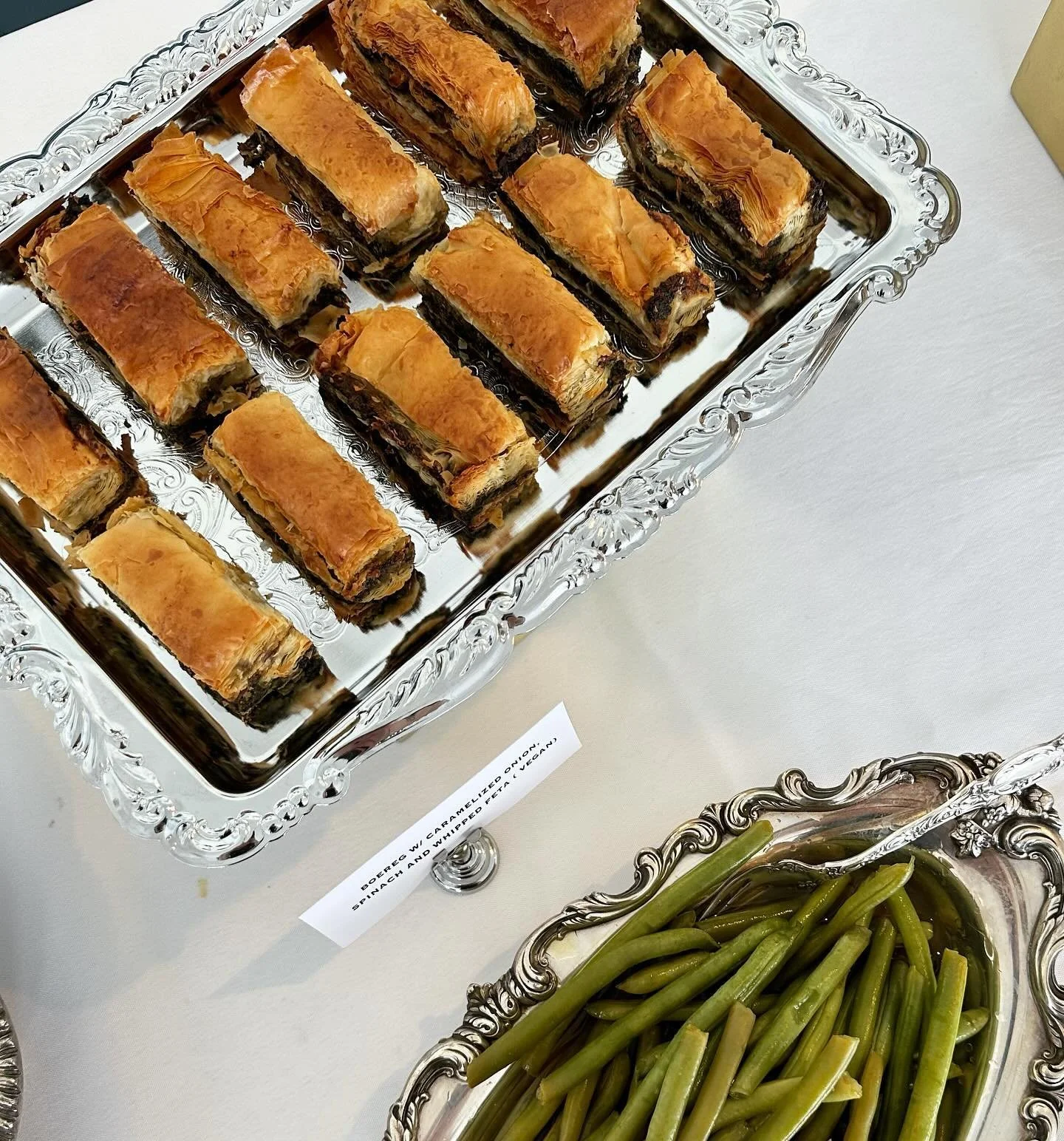 Details from a Sunday afternoon celebrating a milestone birthday &mdash; April 21st, 2024 &mdash; at the New Hamburg Yacht Club. 

Menu highlights include: mini beef wellingtons, boereg with caramelized onion and spinach, smoked eggplant dip and home