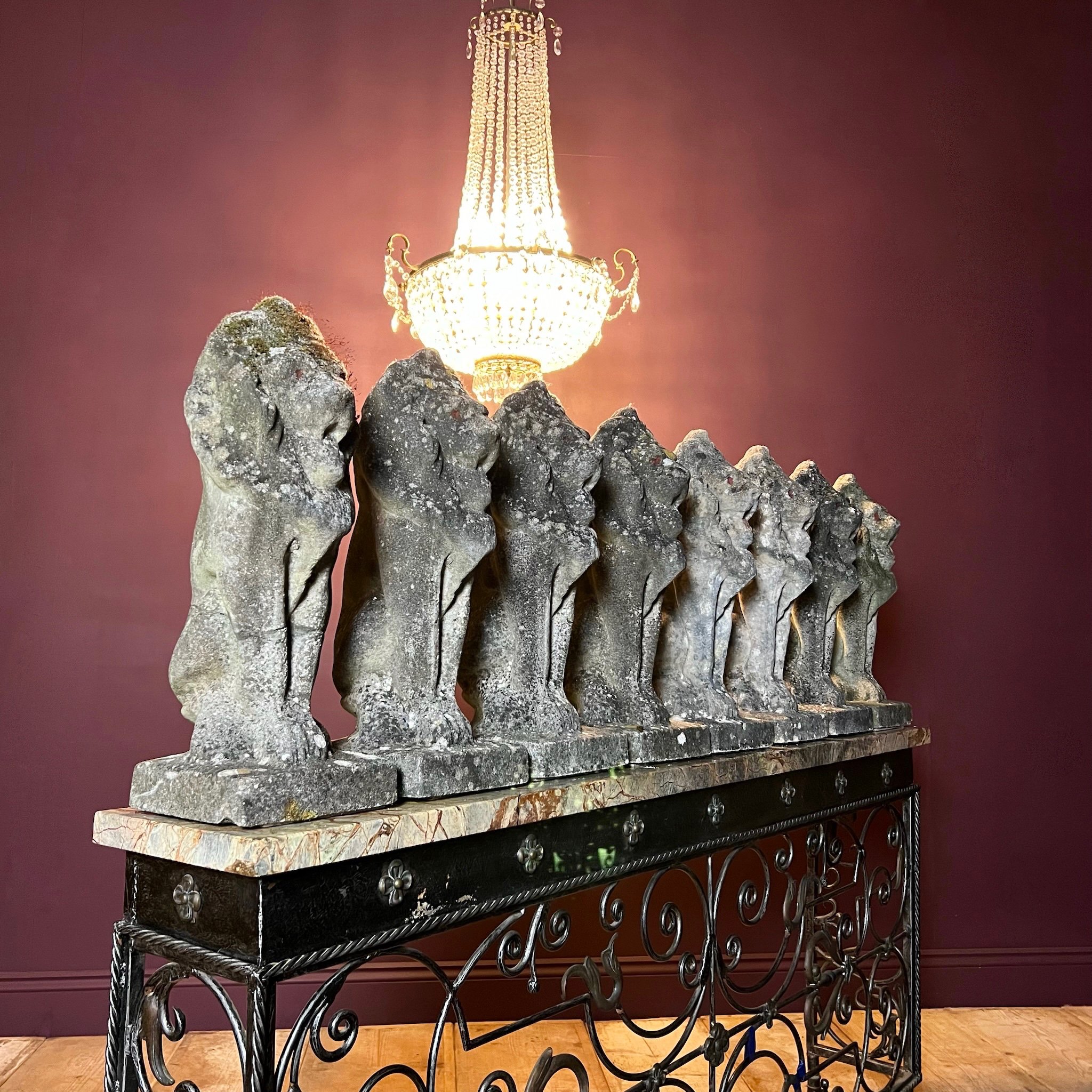 Fine set of eight reconstituted stone seated lions