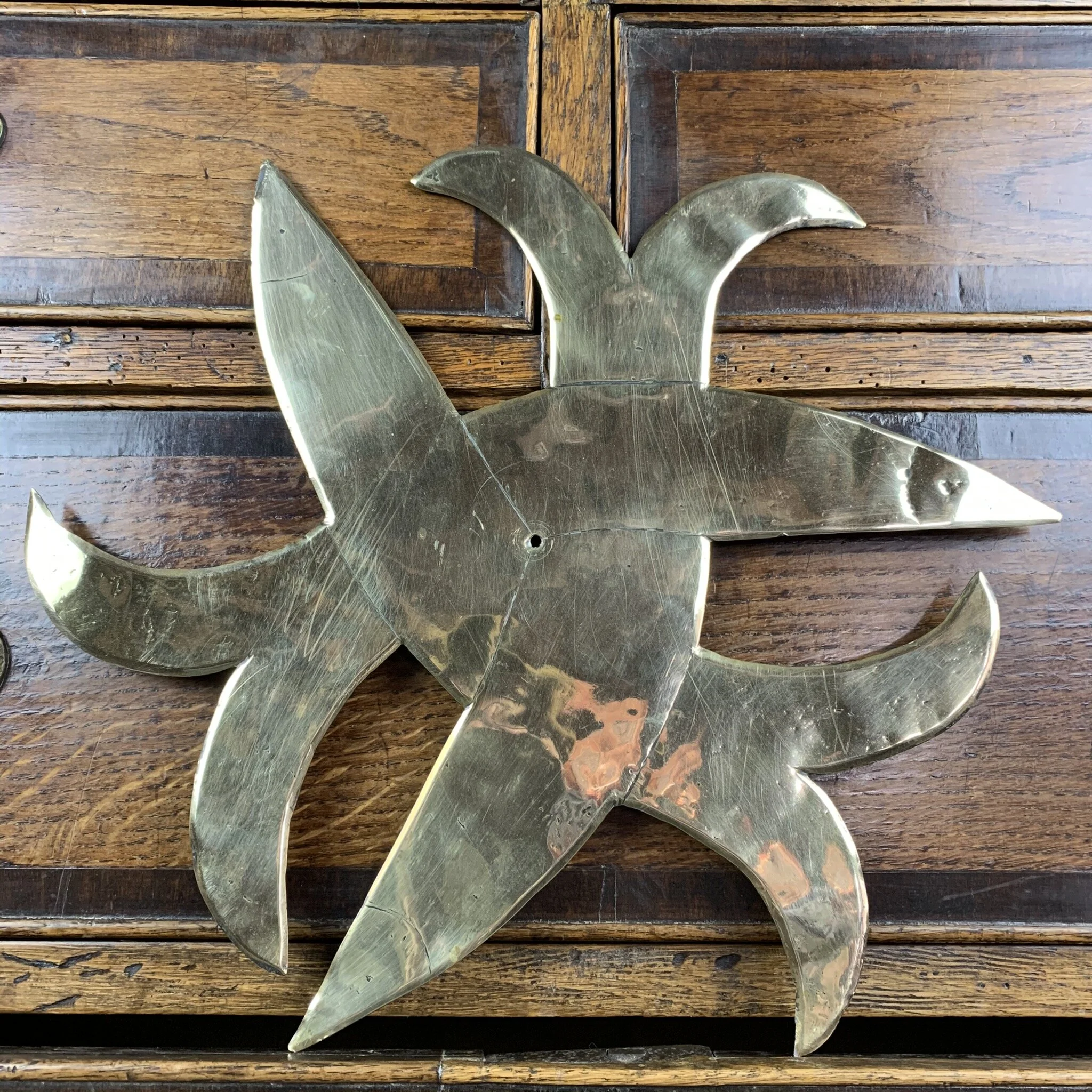 Early and primitive folk art brass Holy Trinity Knot