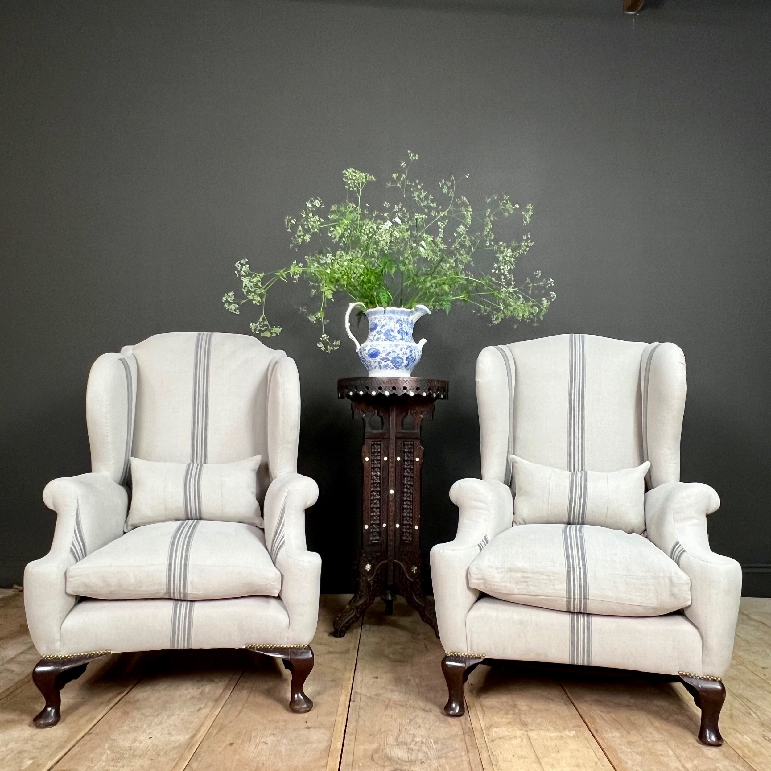 Fine and impressive near pair of English late 19th Century country house wing back arm chairs