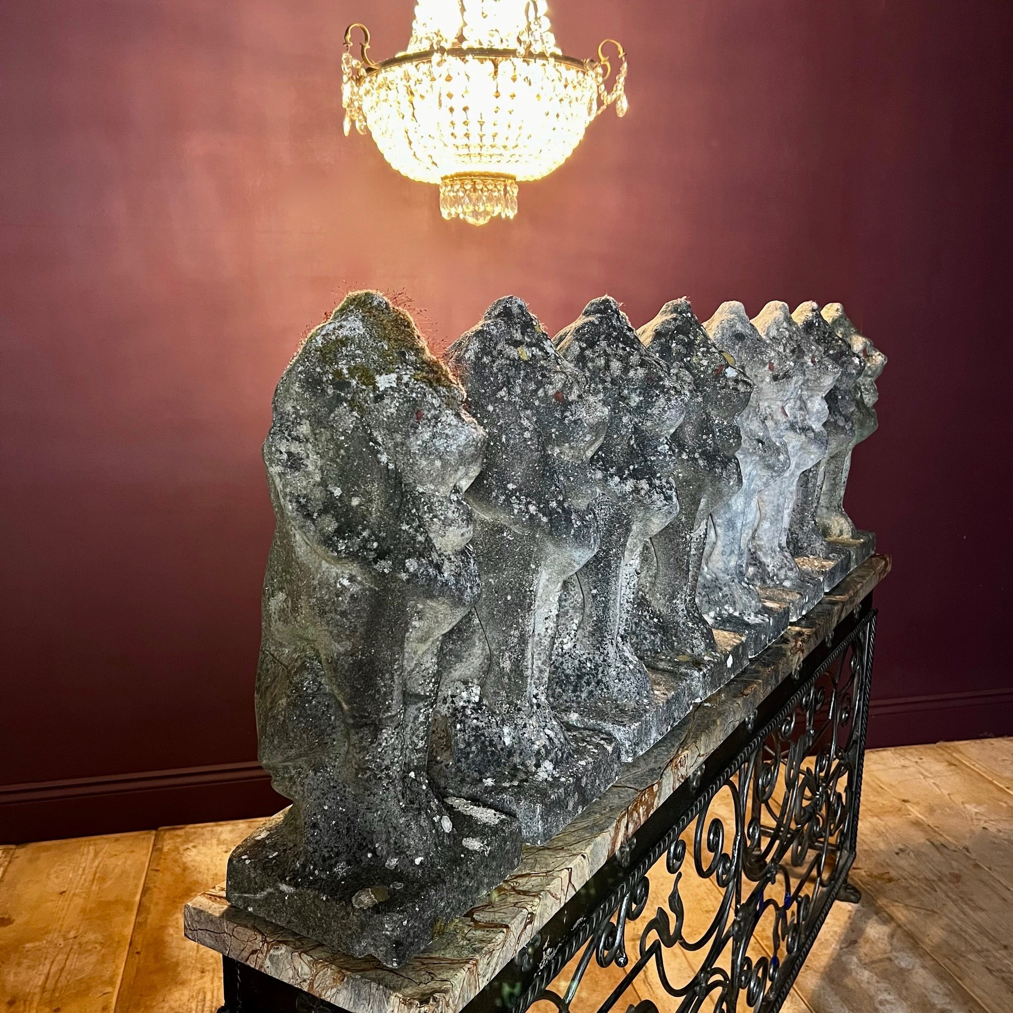 Fine set of eight reconstituted stone seated lions