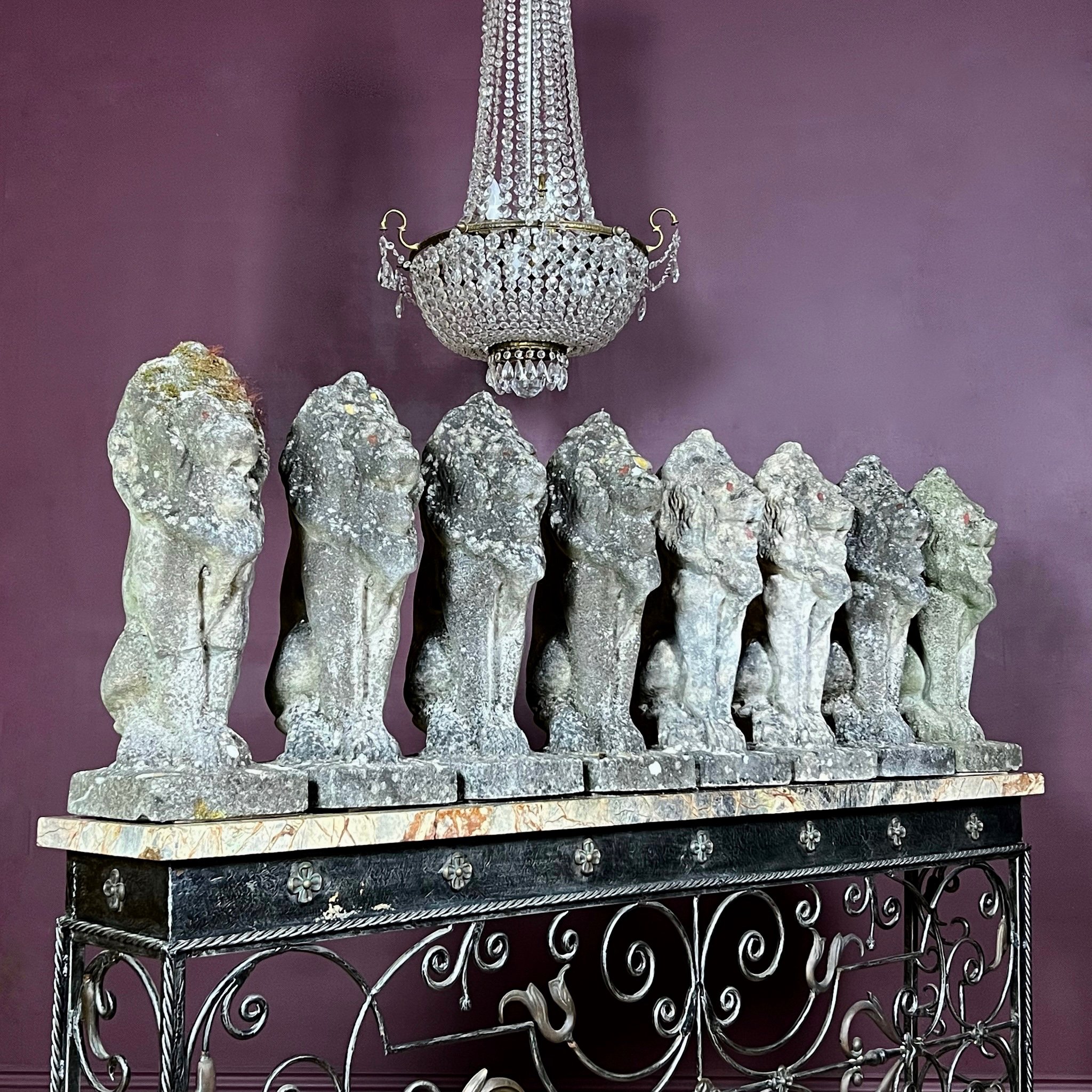 Fine set of eight reconstituted stone seated lions