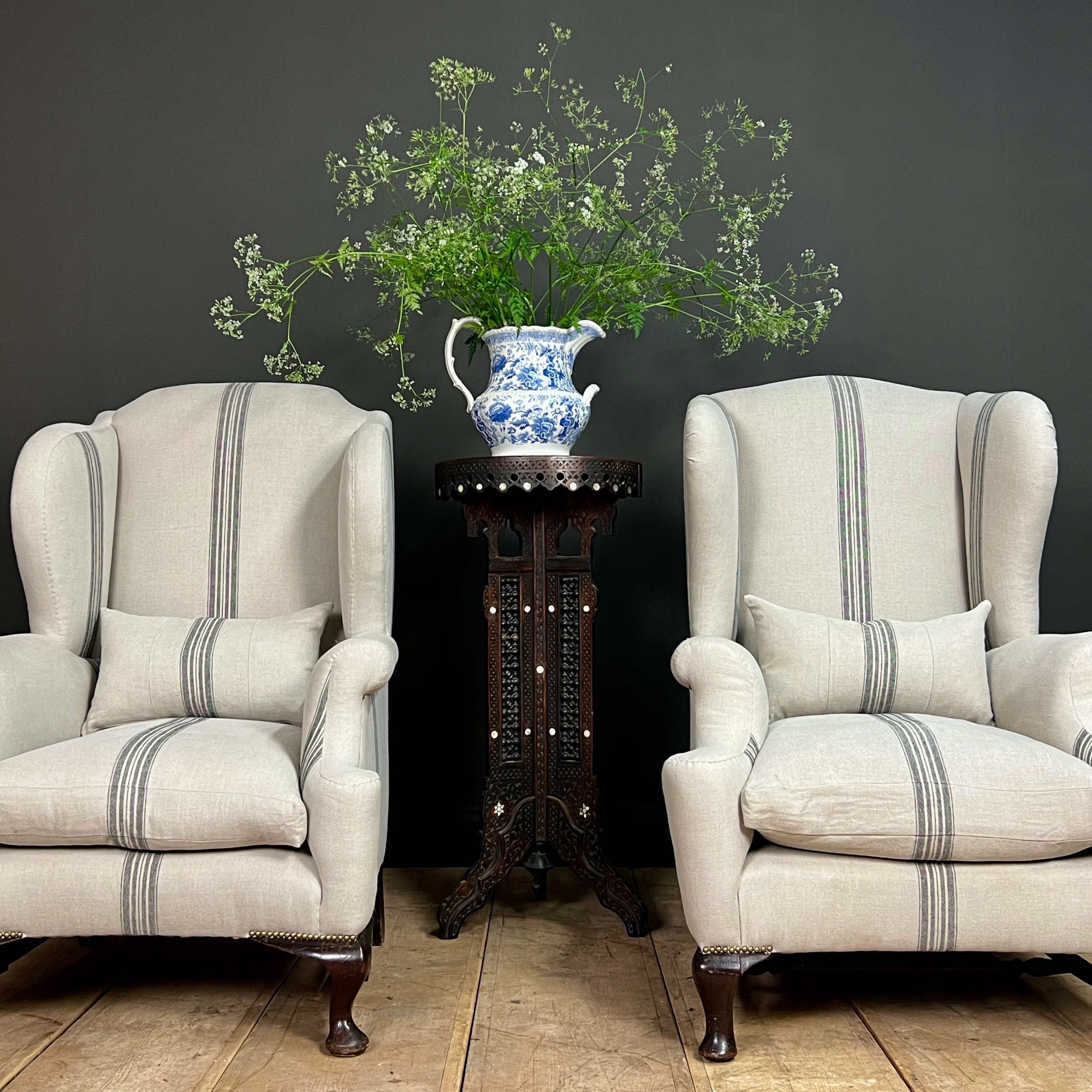 Fine and impressive near pair of English late 19th Century country house wing back arm chairs