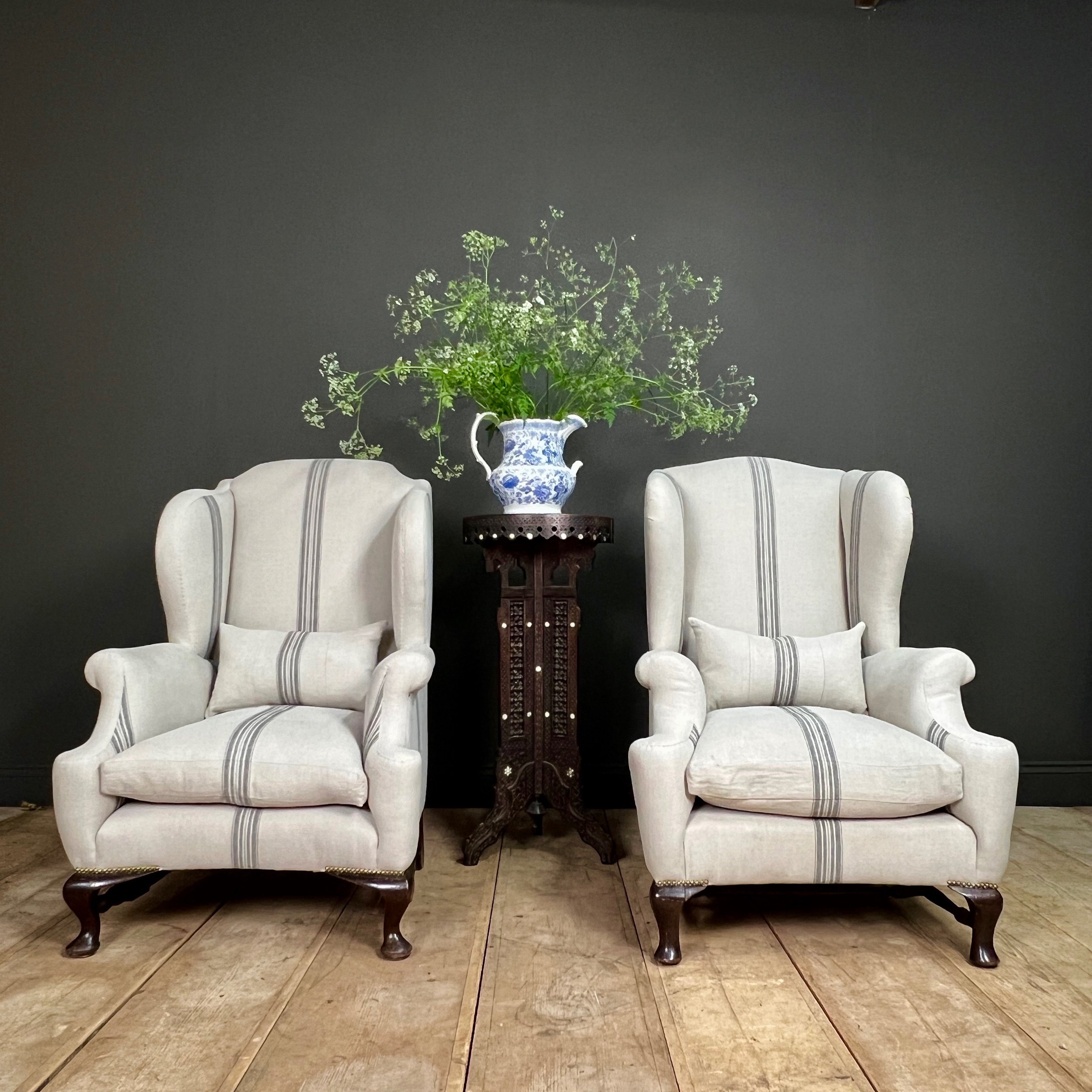 Fine and impressive near pair of English late 19th Century country house wing back arm chairs