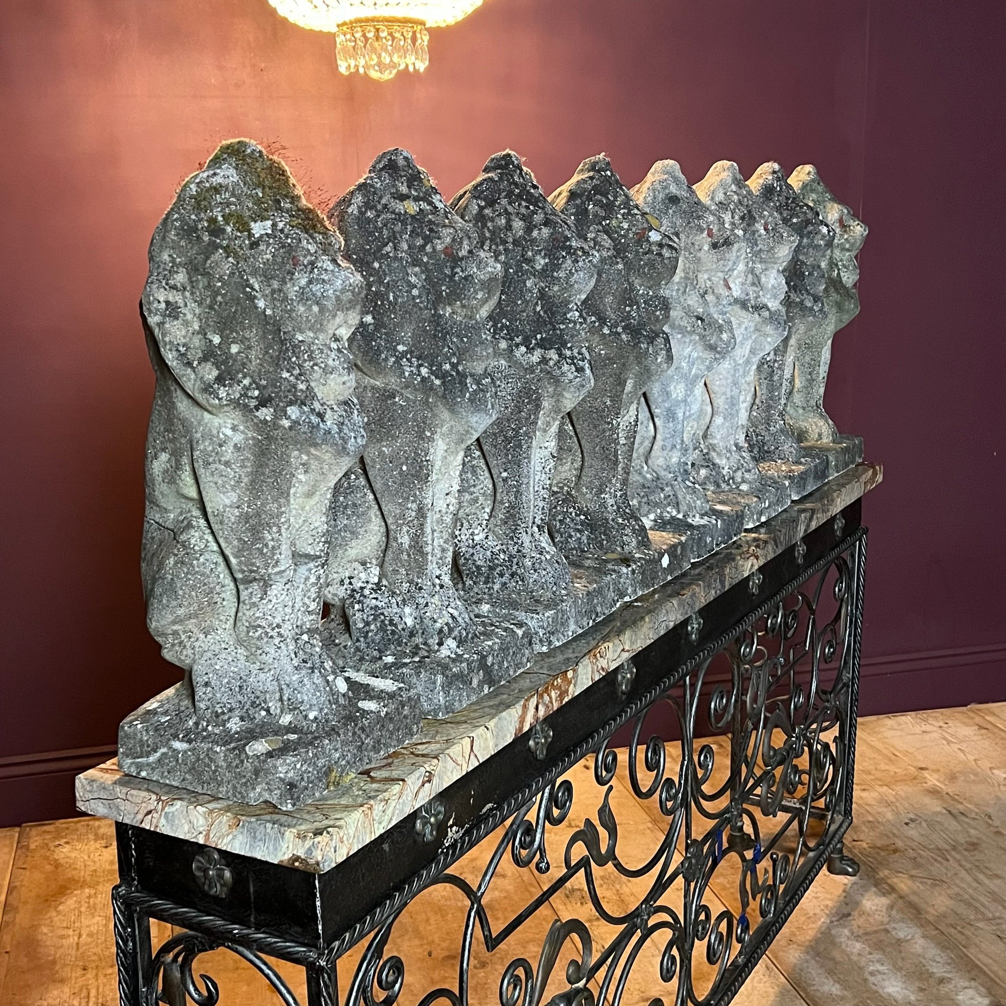 Fine set of eight reconstituted stone seated lions