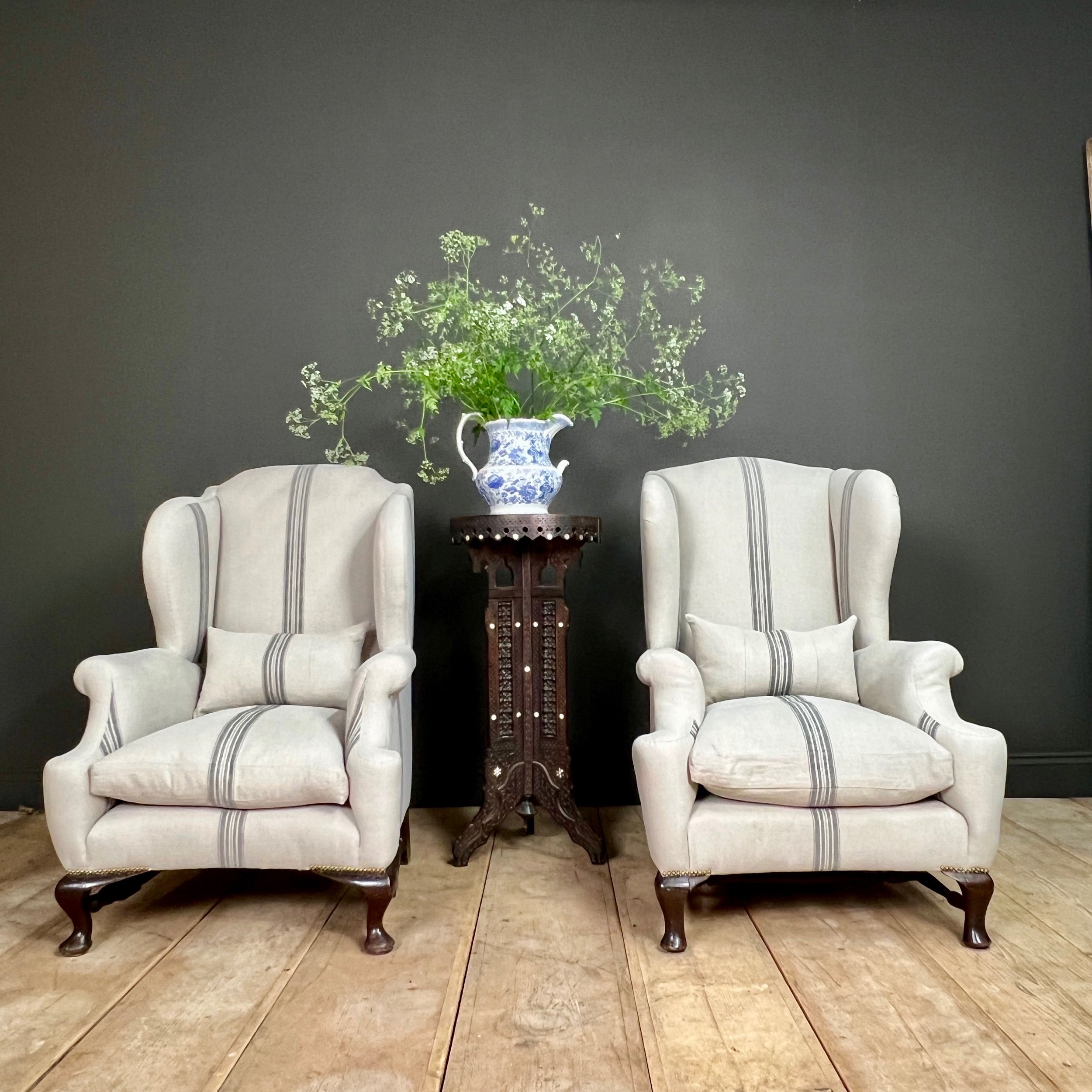 Fine and impressive near pair of English late 19th Century country house wing back arm chairs
