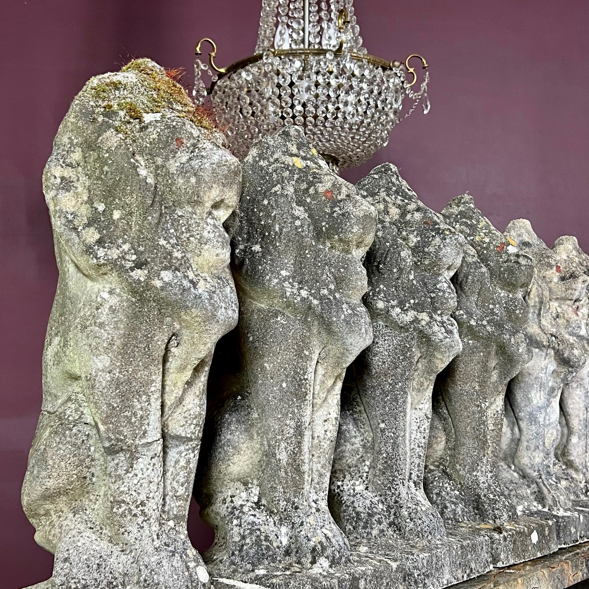 Fine set of eight reconstituted stone seated lions