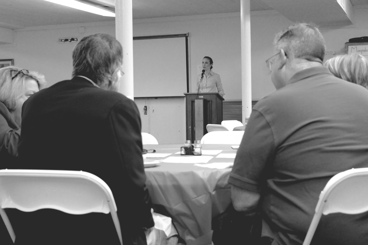 Rev. Erin Roesch, Director of Development and Employer Recruitment at StepUp and clergy in the NC Conference of the UMC, leads the group in a discussion of God's call to steward the gift of economic opportunity in Jeremiah 29 and Exodus 23