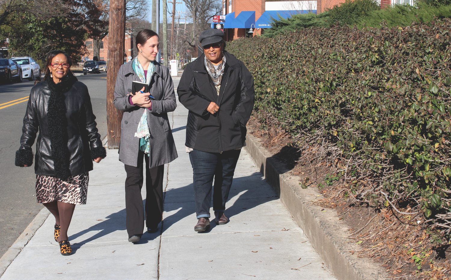 Measurement Incorporated HR Director, Janis Clark Davis (right), tells Erin Roesch (center) why she hires from StepUp Durham and how the employees she has hired are doing.
