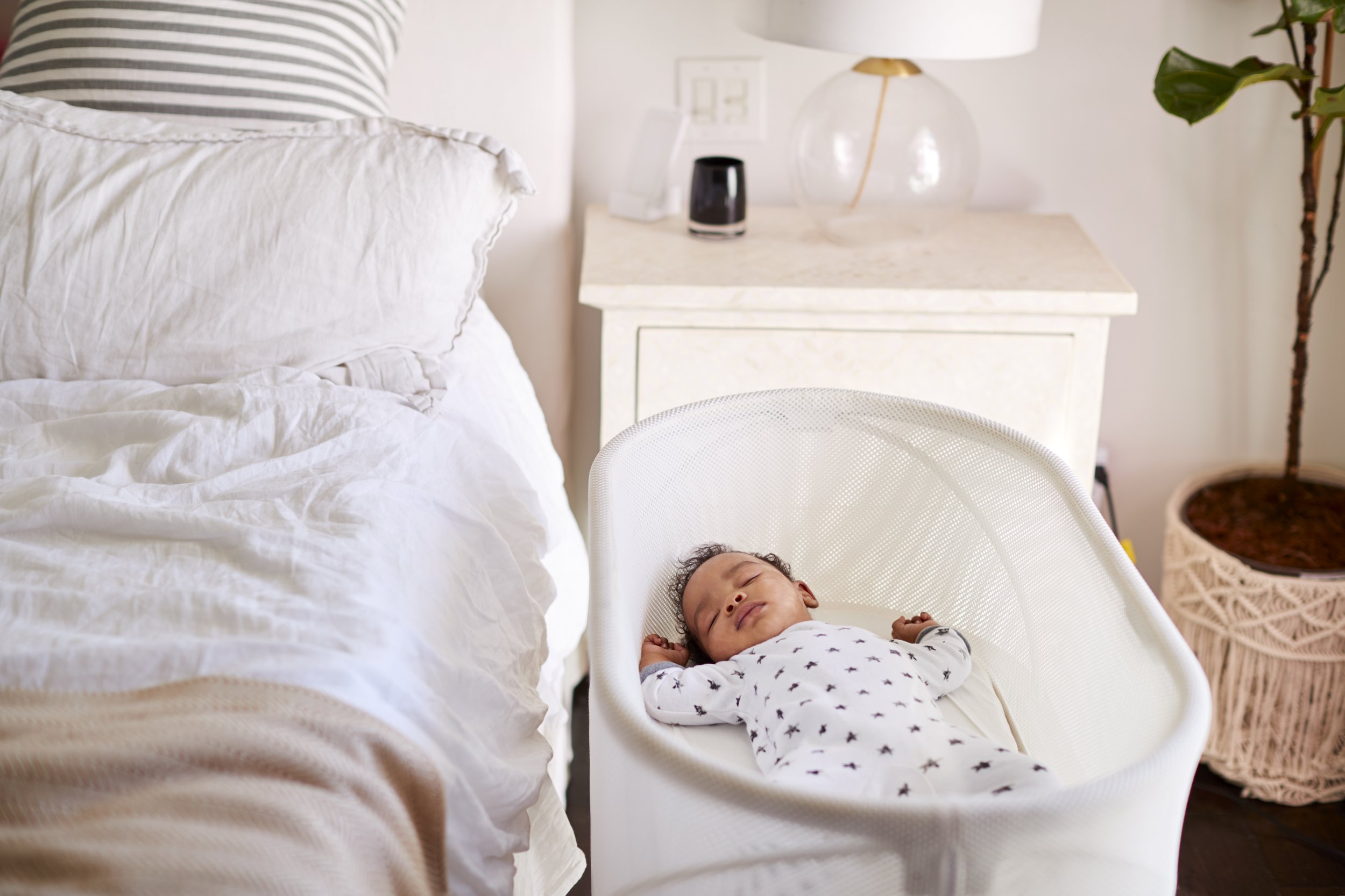 three-month-old-baby-asleep-in-his-cot-beside-the-2021-08-26-16-13-25-utc.jpg