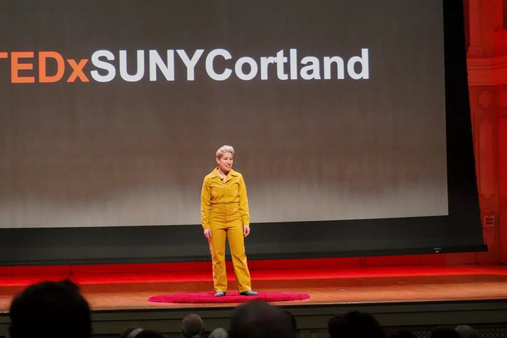Lee doing their TEDX talk public speaking without anxiety