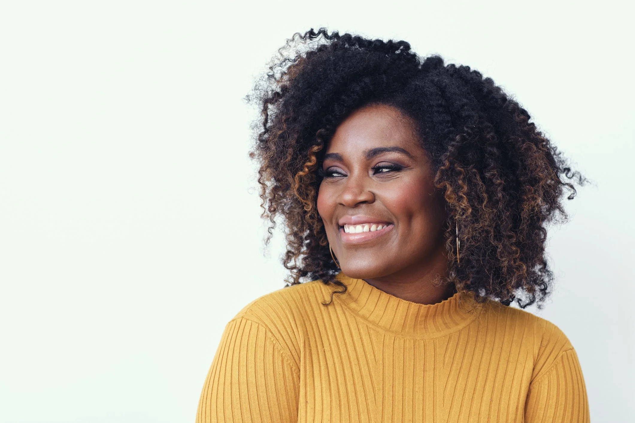Black woman smiling joyfully — individual therapy for women in Katy TX