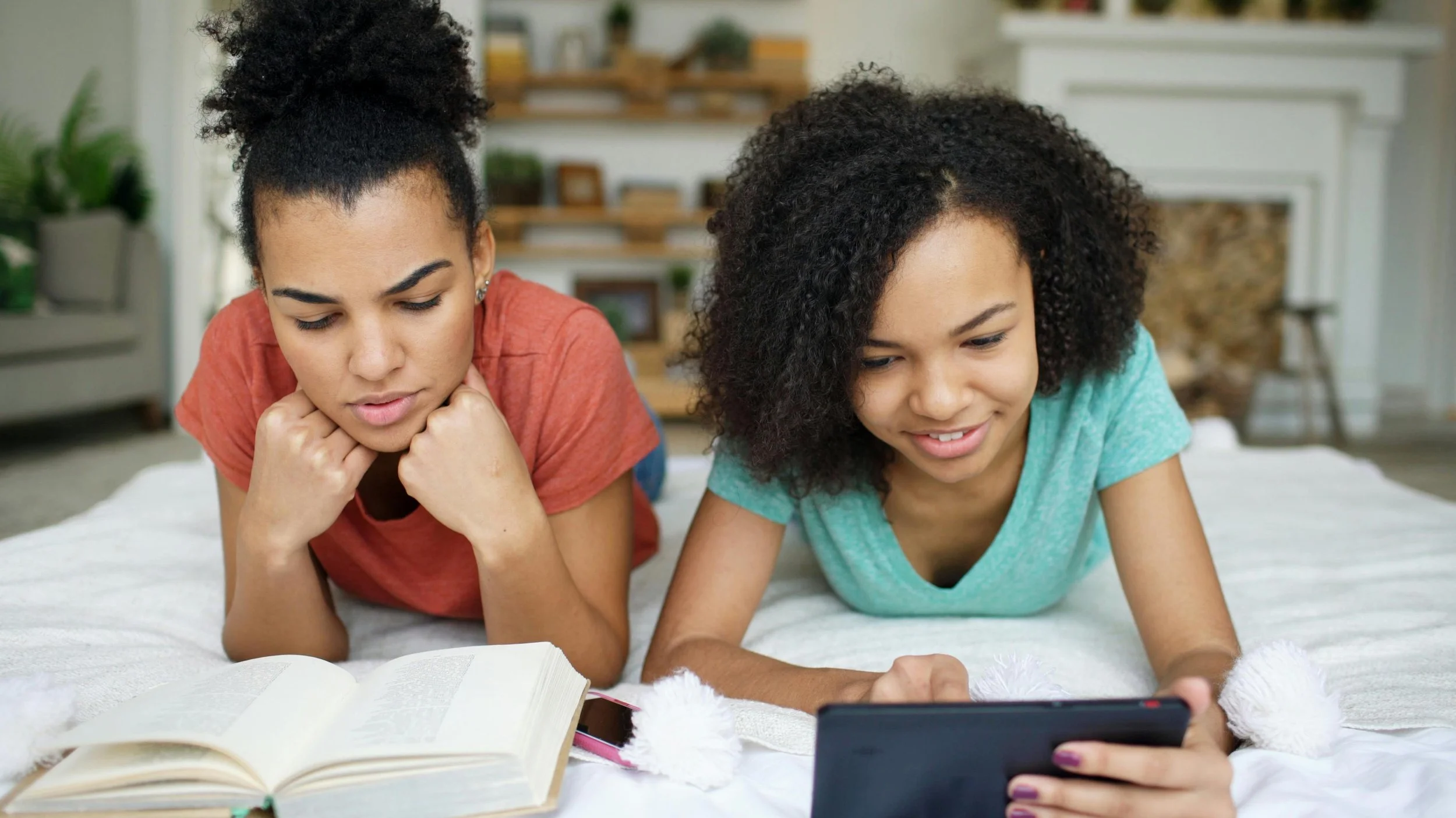 Black mother and teenage daughter lying together — teen parenting therapy consultation in Houston TX