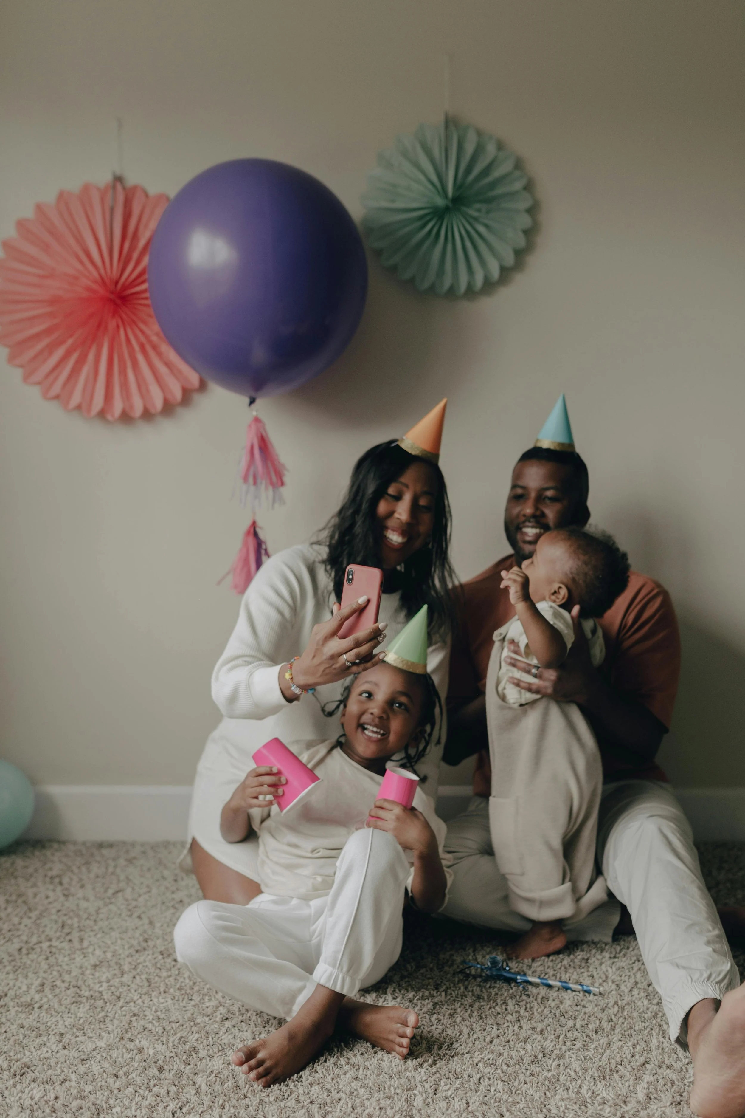 parents and children playing together — co-parenting therapy with Ra'Shunda Adams LMFT-Associate, Houston TX