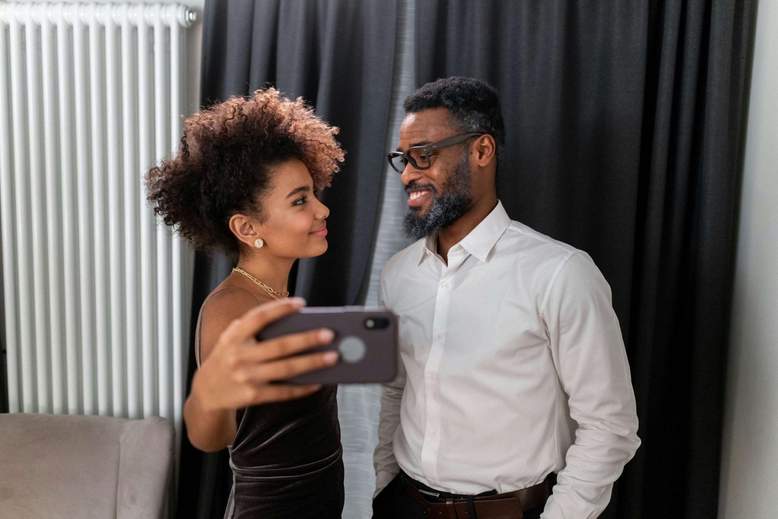 Couple smiling and taking a selfie together — premarital coaching with The B-Side of Marriage, Houston TX